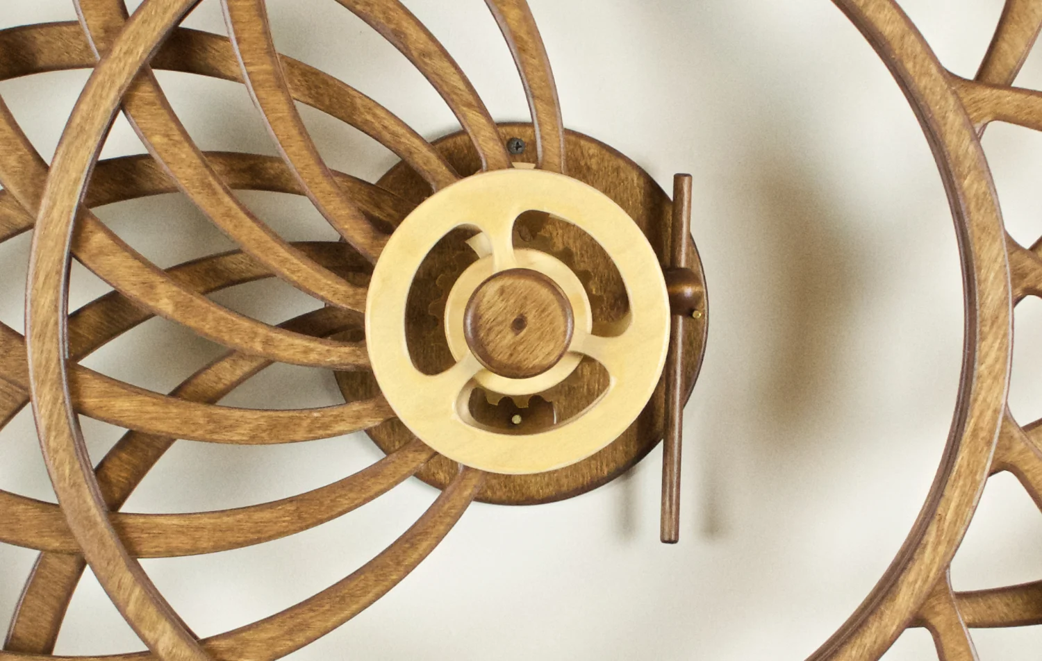 Spring-driven, Kinetic Wooden Wall sculpture by David C. Roy of WoodThatWorks.com. Duality runs for 8 hours per winding an is in an edition of 95. copyright 2017