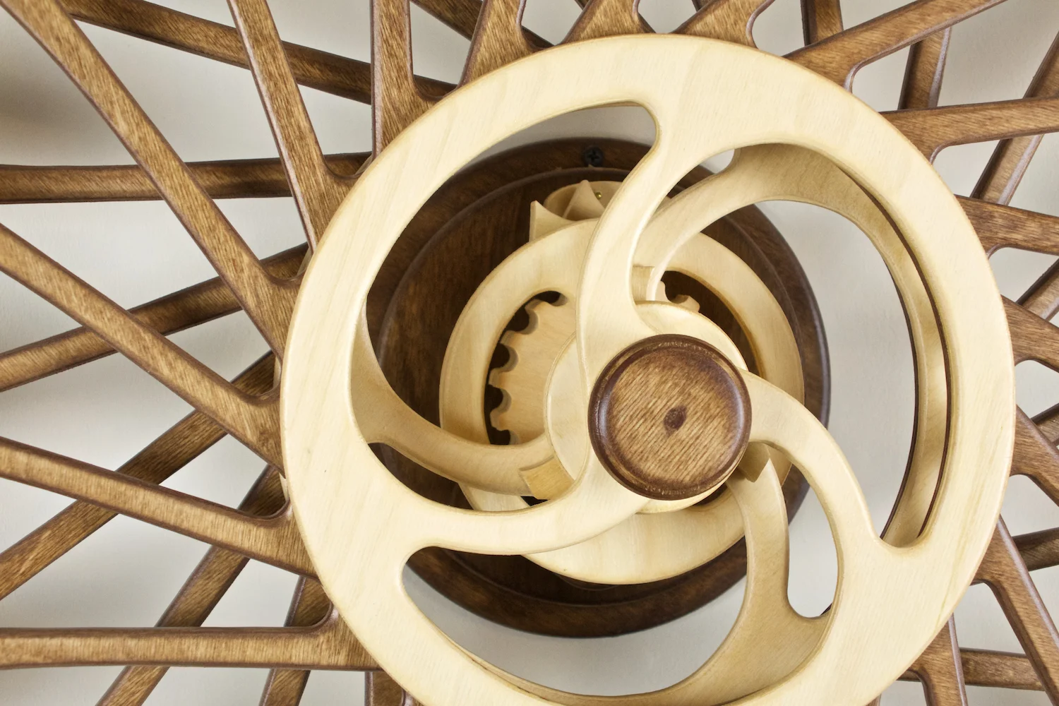 Spring-driven, Kinetic Wooden Wall sculpture by David C. Roy of WoodThatWorks.com. Kindala-Stars runs for 12 hours per winding an is in an edition of 12. copyright 2017