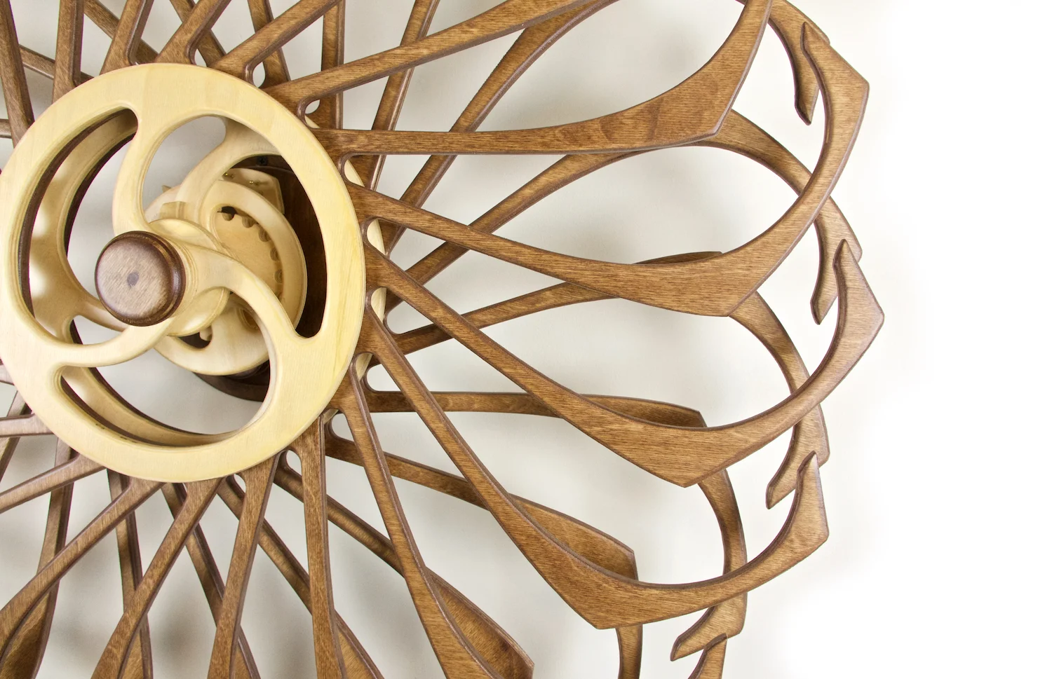Spring-driven, Kinetic Wooden Wall sculpture by David C. Roy of WoodThatWorks.com. Kindala-Stars runs for 12 hours per winding an is in an edition of 12. copyright 2017