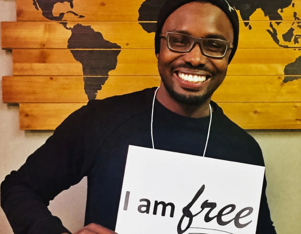 Participant holding I am free sign