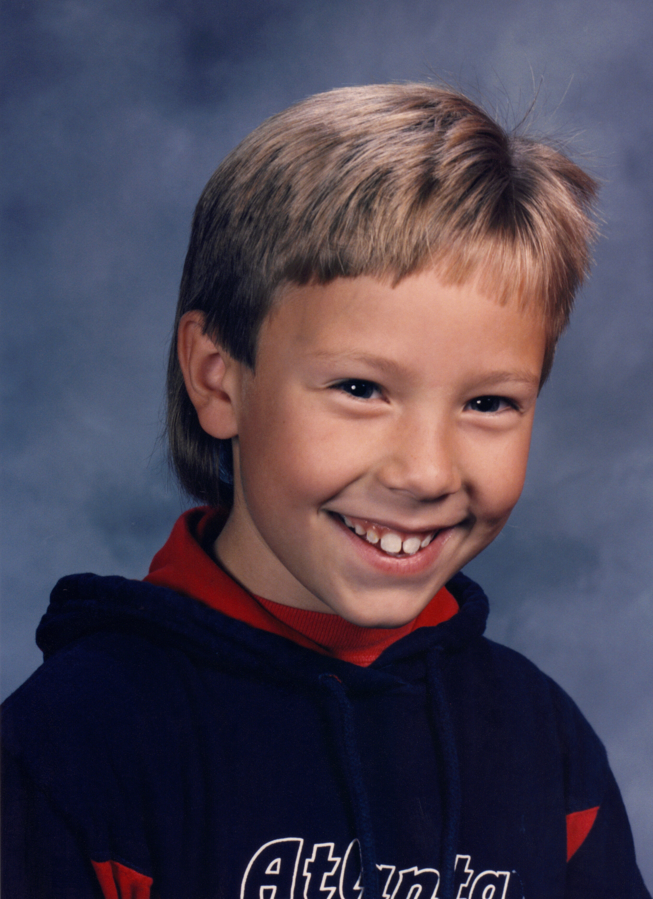 School portrait of author in 2nd grade