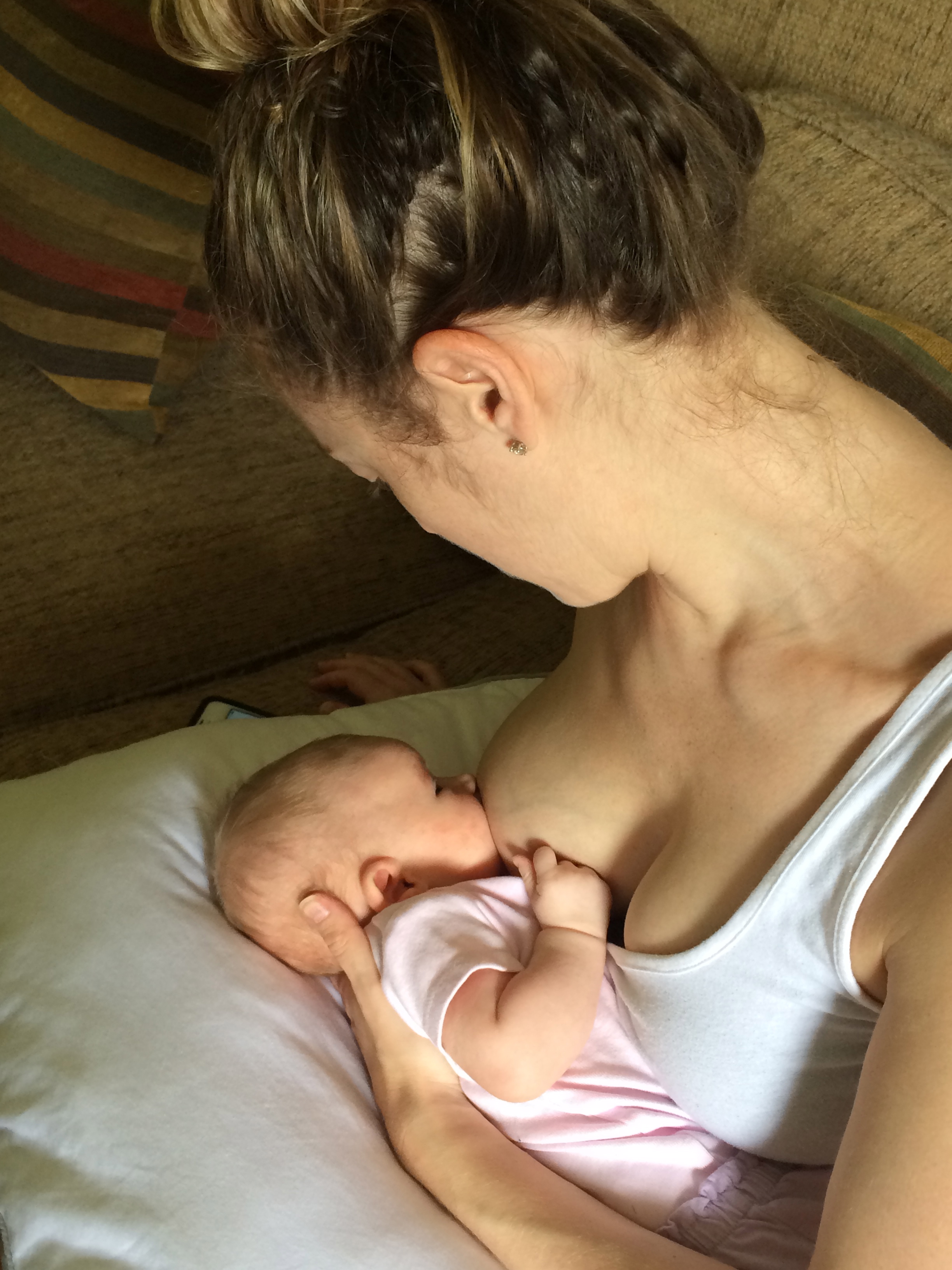 One last piece of advice, cuz: Take a deep breath, relax your neck and shoulders and try leaning back just a bit so you can more comfortably gaze down at your baby. For all new moms, breastfeeding is a work in progress...