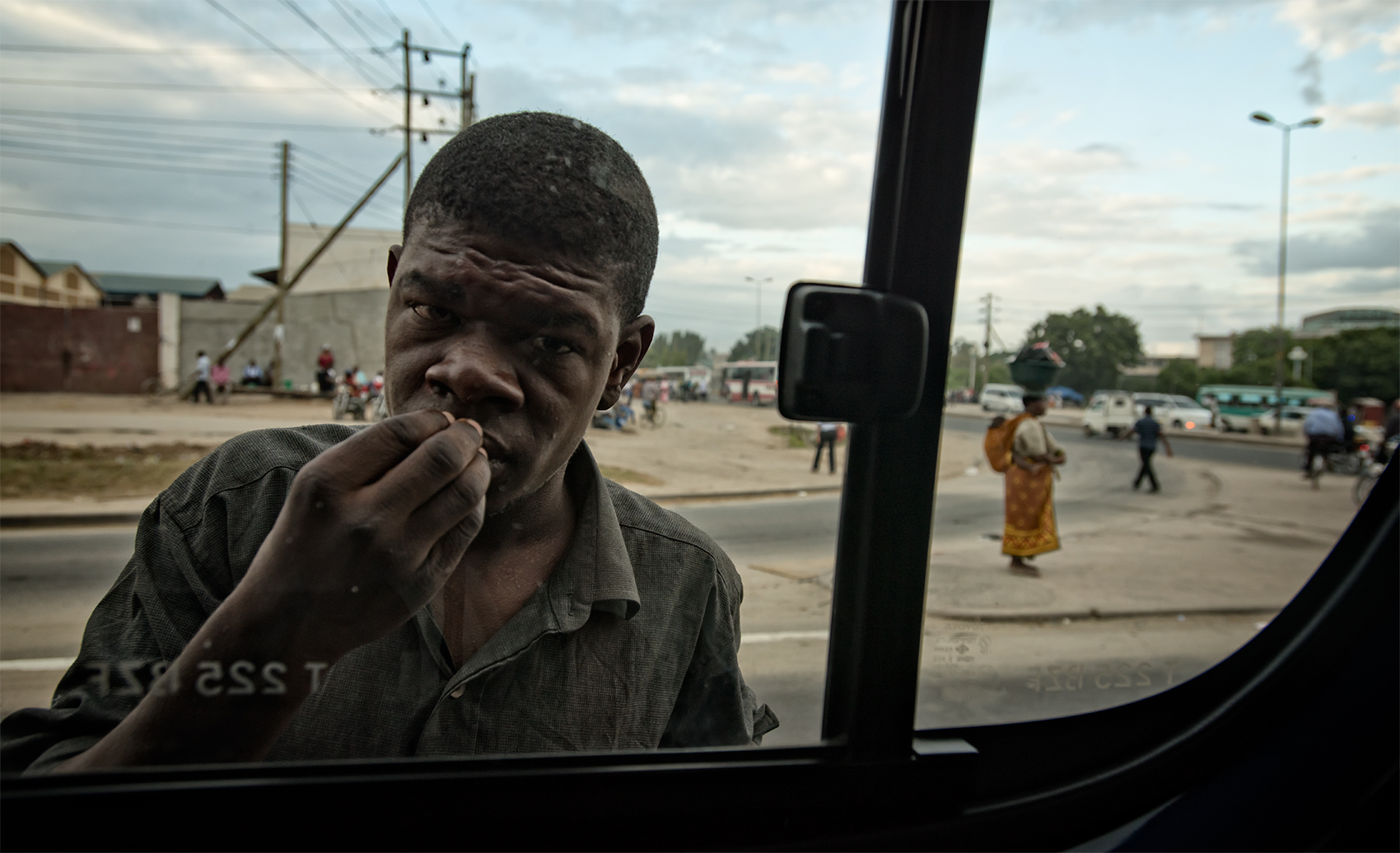 Hungry at the window, Dar Es Salaam, Tanzania