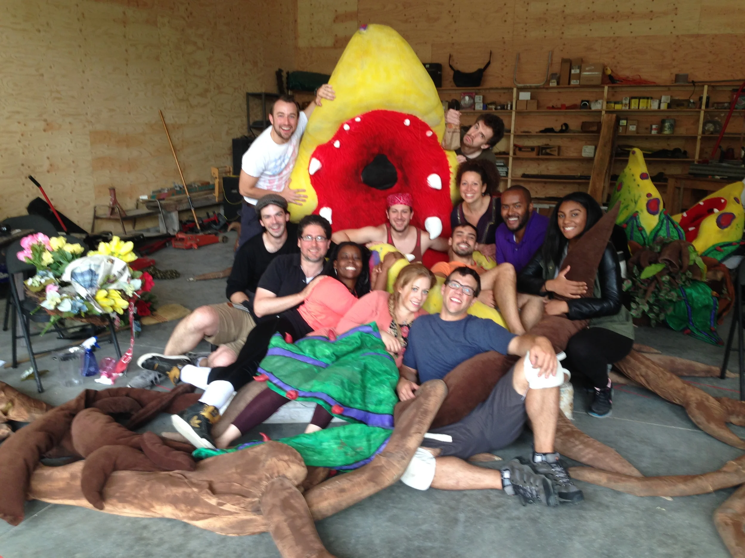  The cast of The Barnstormers Theatre production of&nbsp; Little Shop of Horrors &nbsp;inside the large Audrey II puppet. 