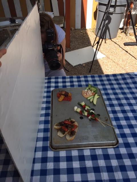 Annie behind the lens at a shoot for Austin Daily Press . 