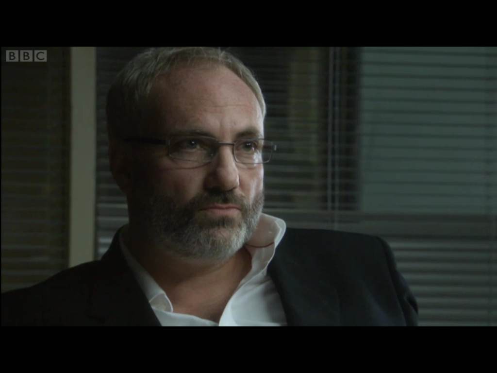 Prosecutor with nicely trimmed beard