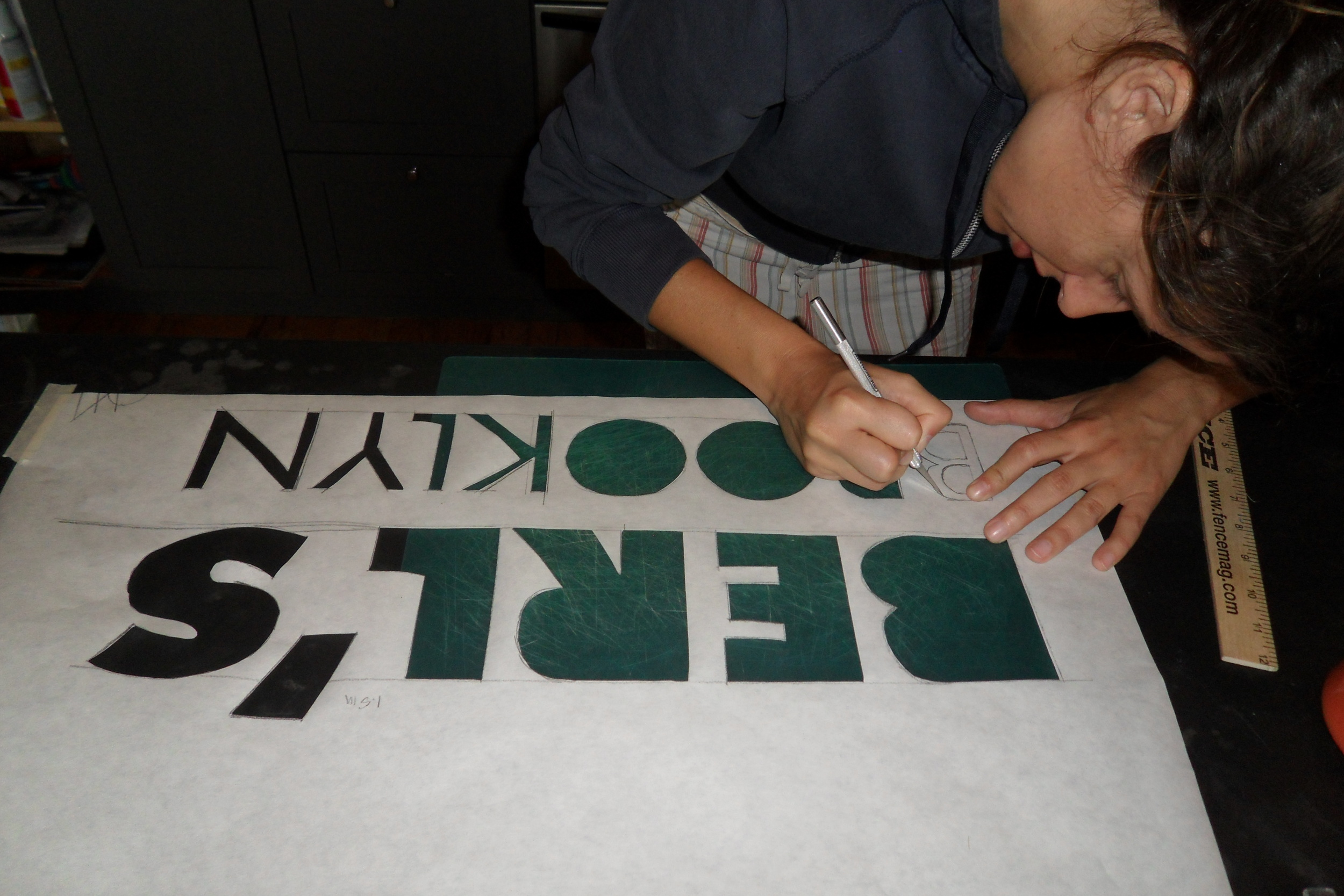  Farrah cutting a stencil for our banner 