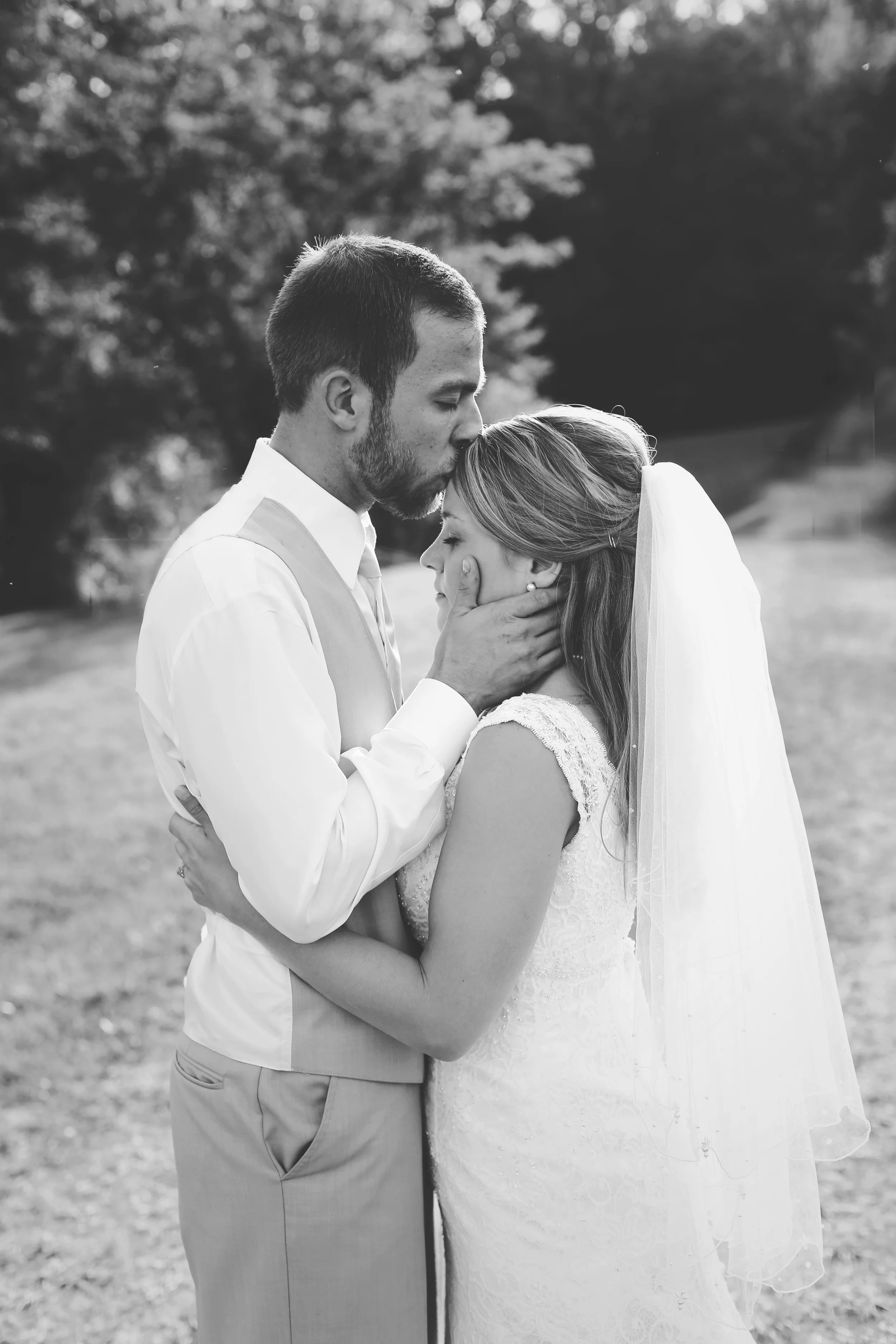 bride and groom in a field