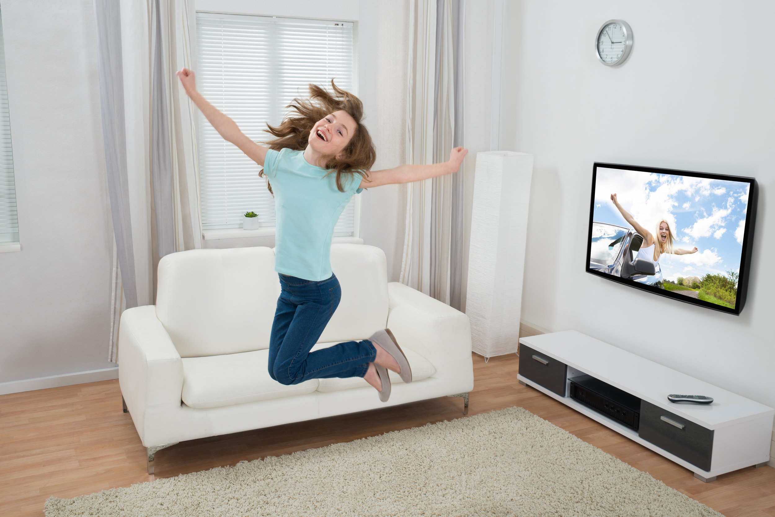 Girl Jumping In Living Room