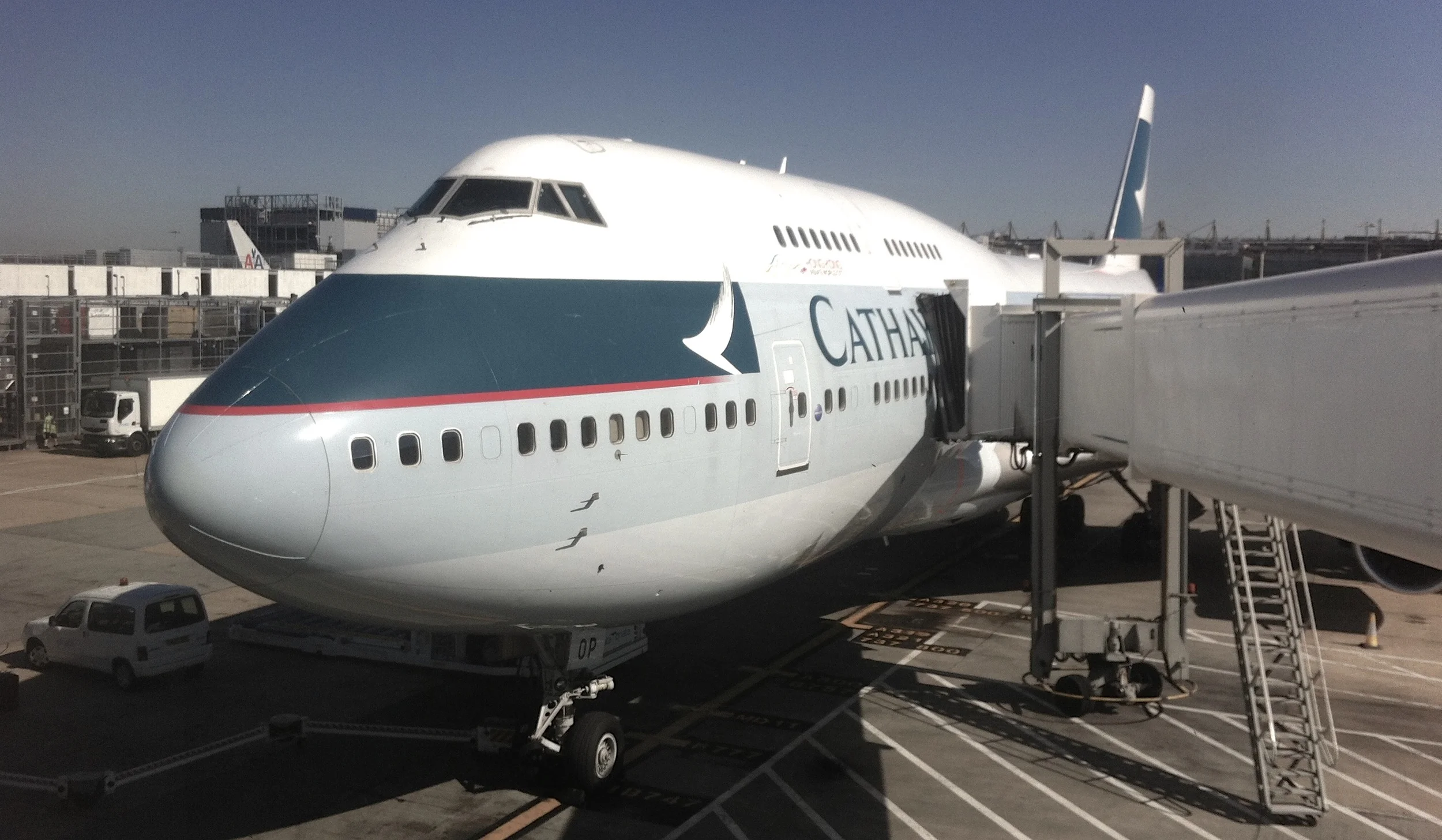 I feel excitement seeing this massive steel bird getting ready outside the airport window.