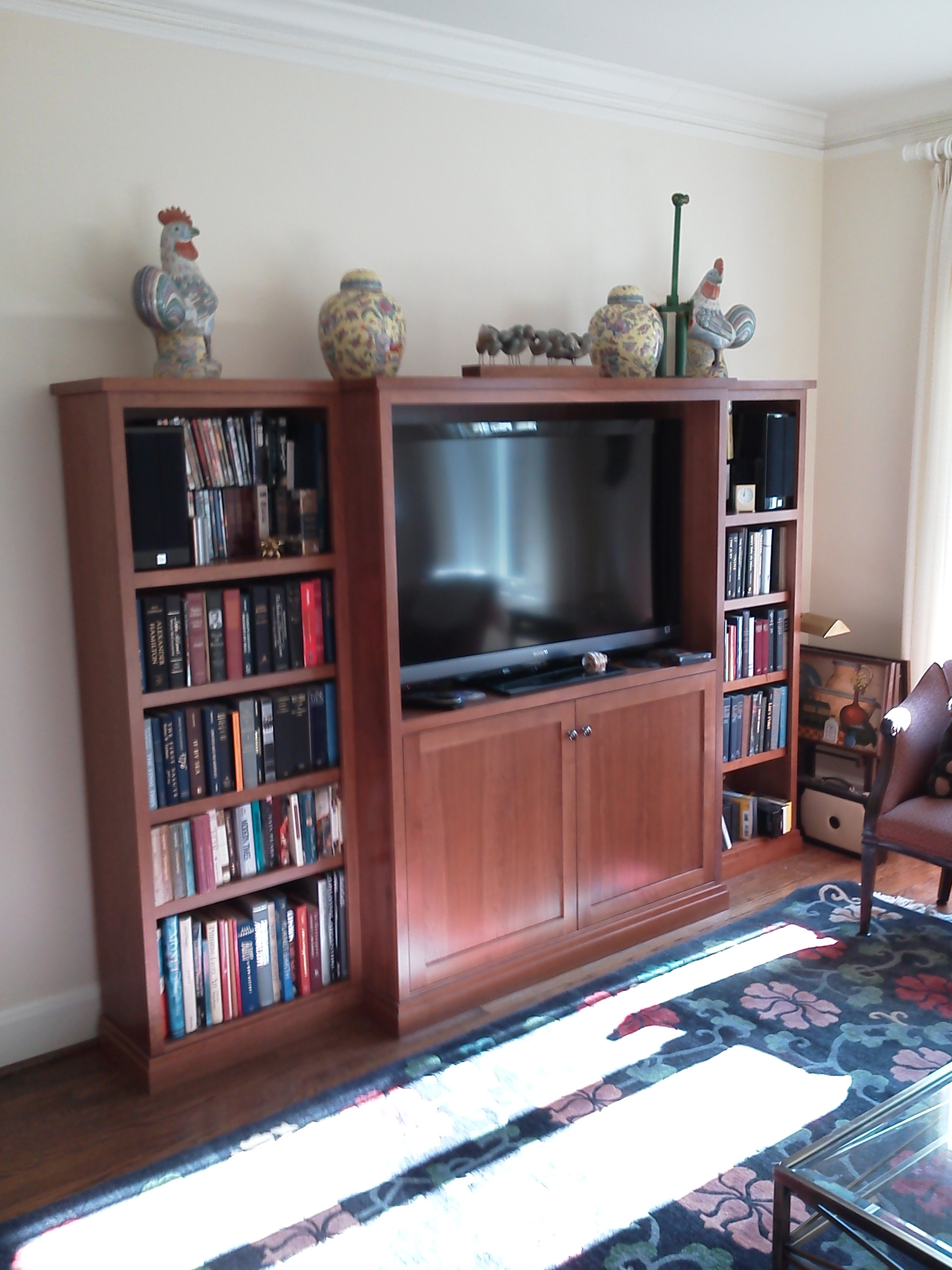 Cherry freestanding media cabinet.