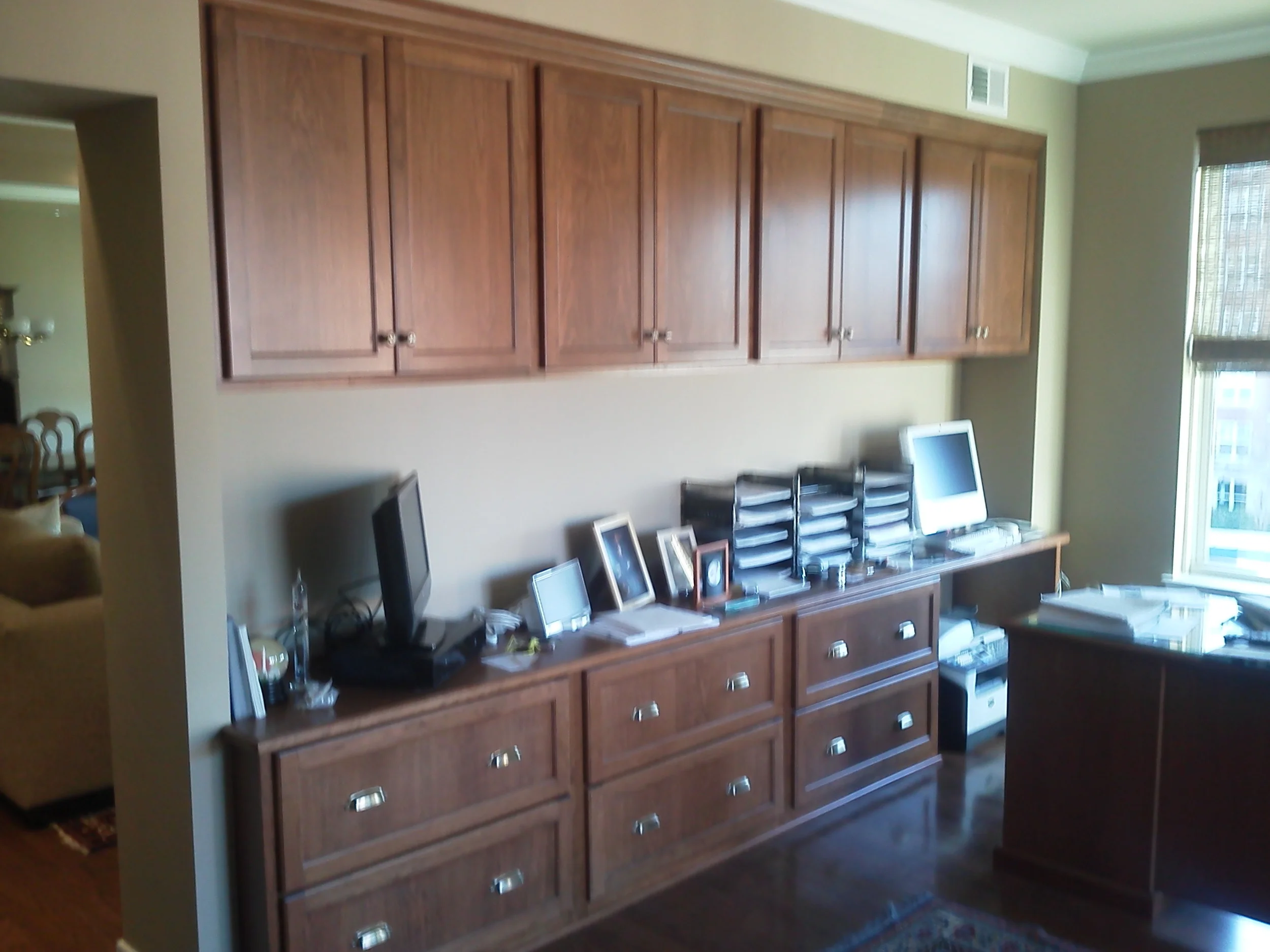 Cherry cabinets and lateral file drawers.
