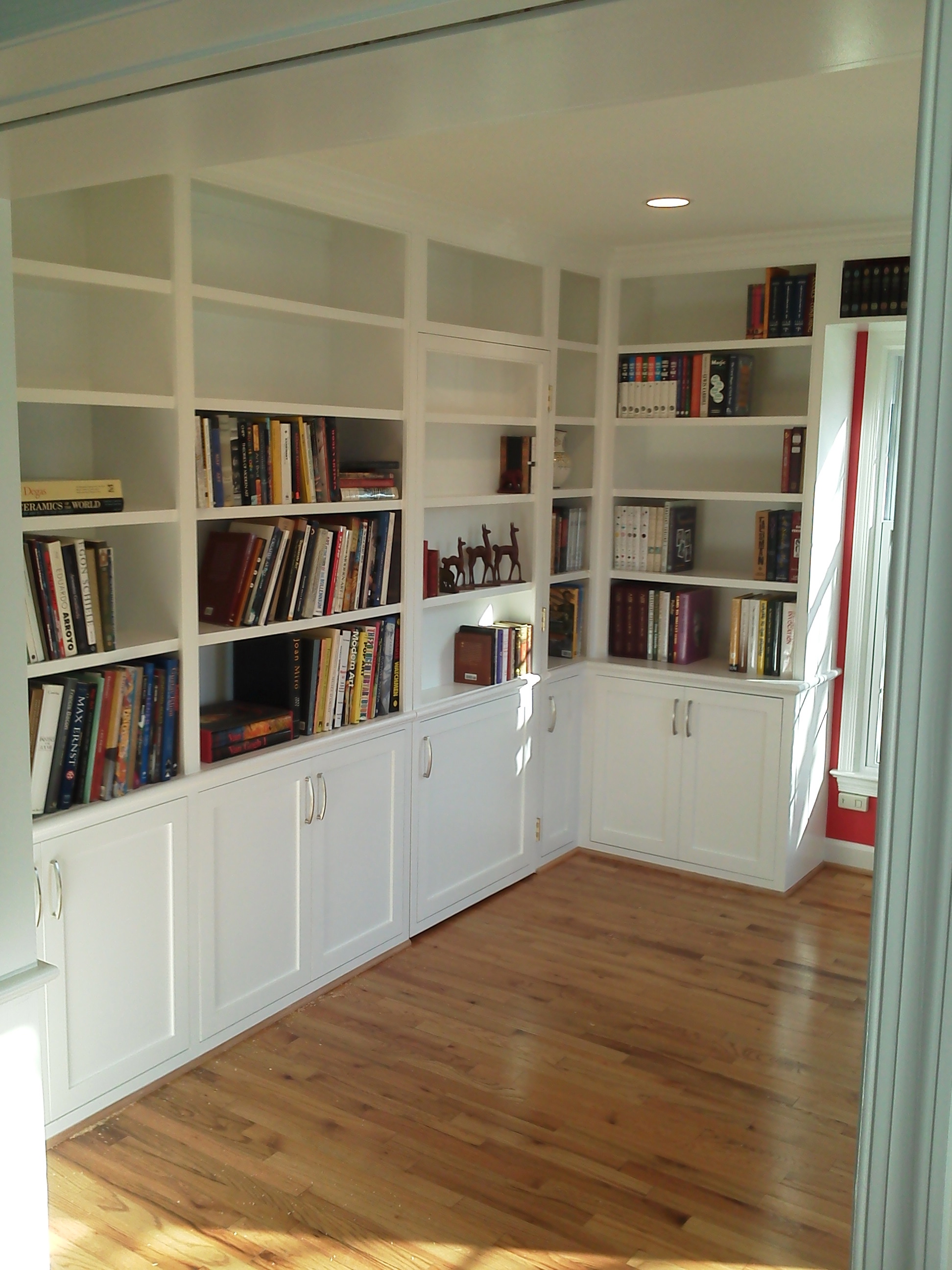 Four walls of cabinets and bookcases.