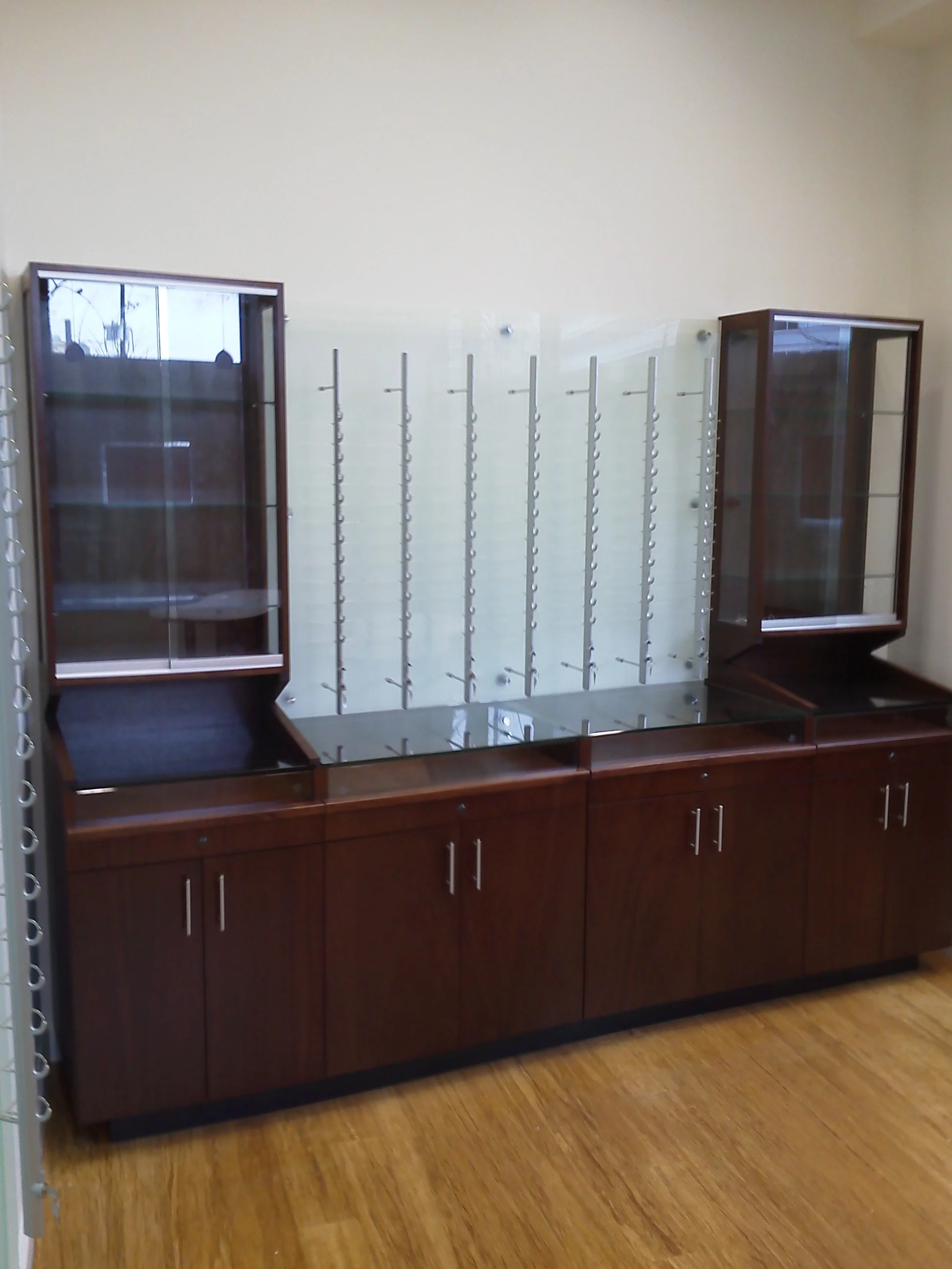 Mahogany eyeglass store cabinetry.