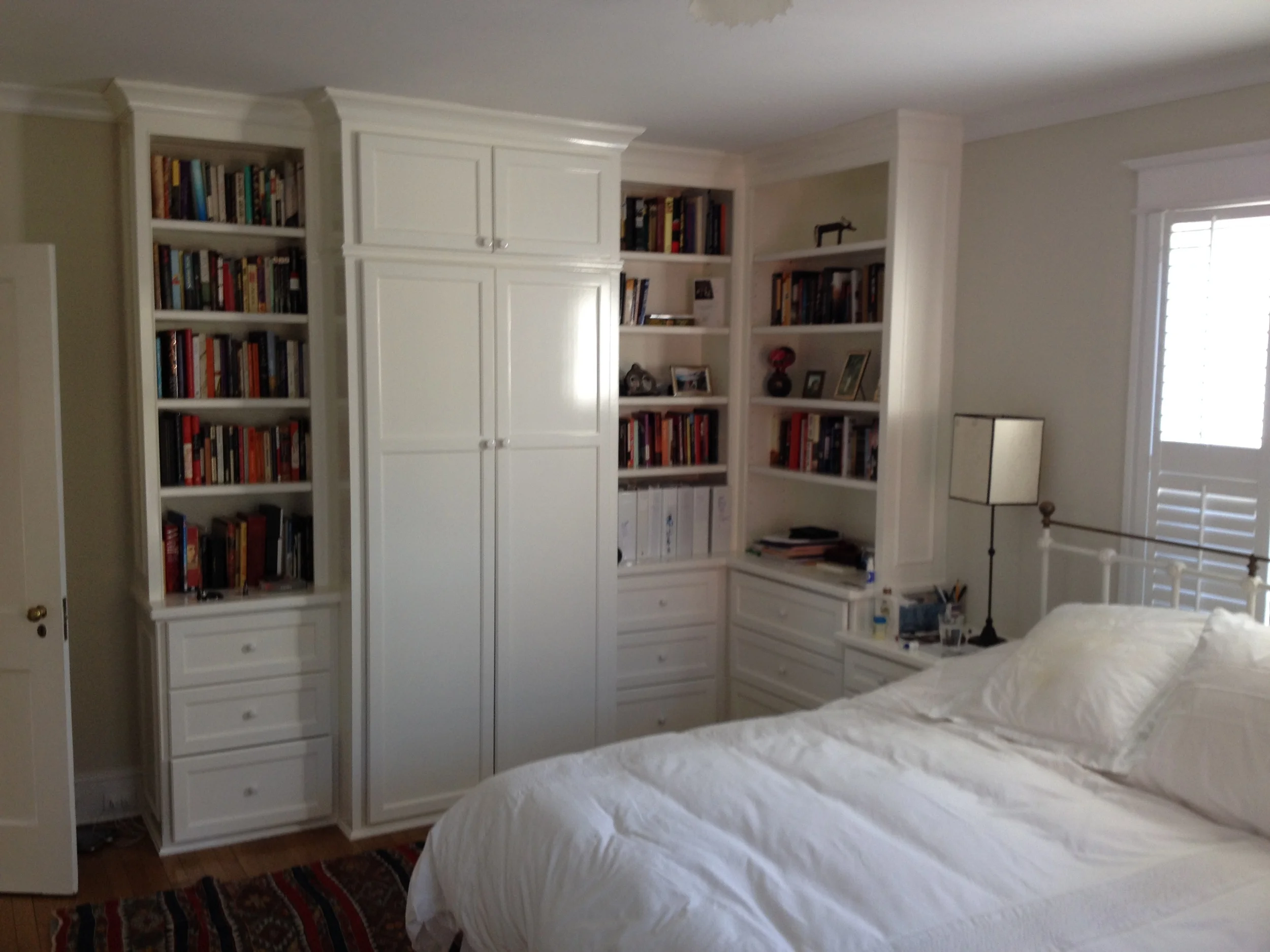 Wardrobe and drawers for clothes and bookcases.