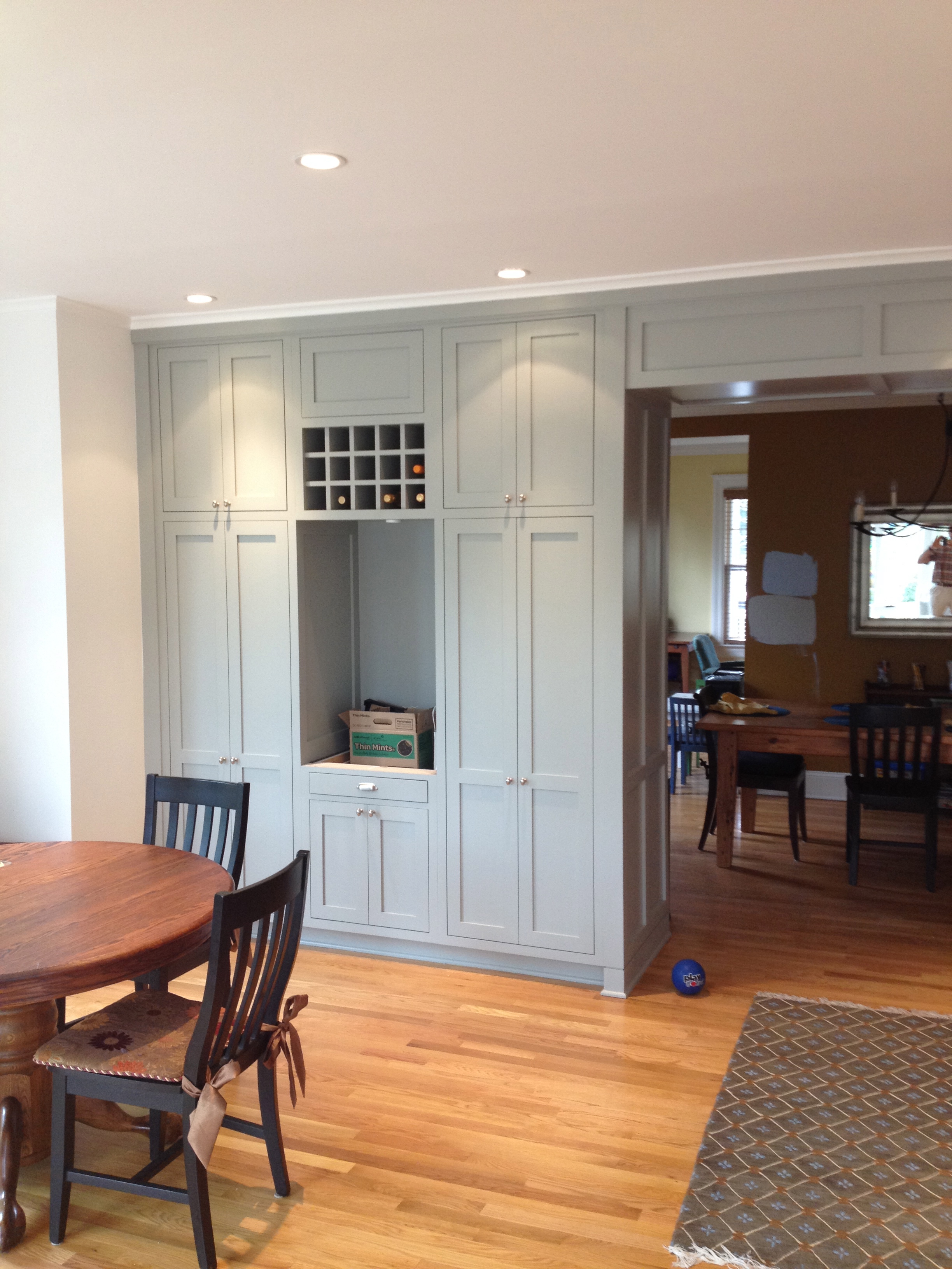 DC kitchen storage and paneled opening to dining room.