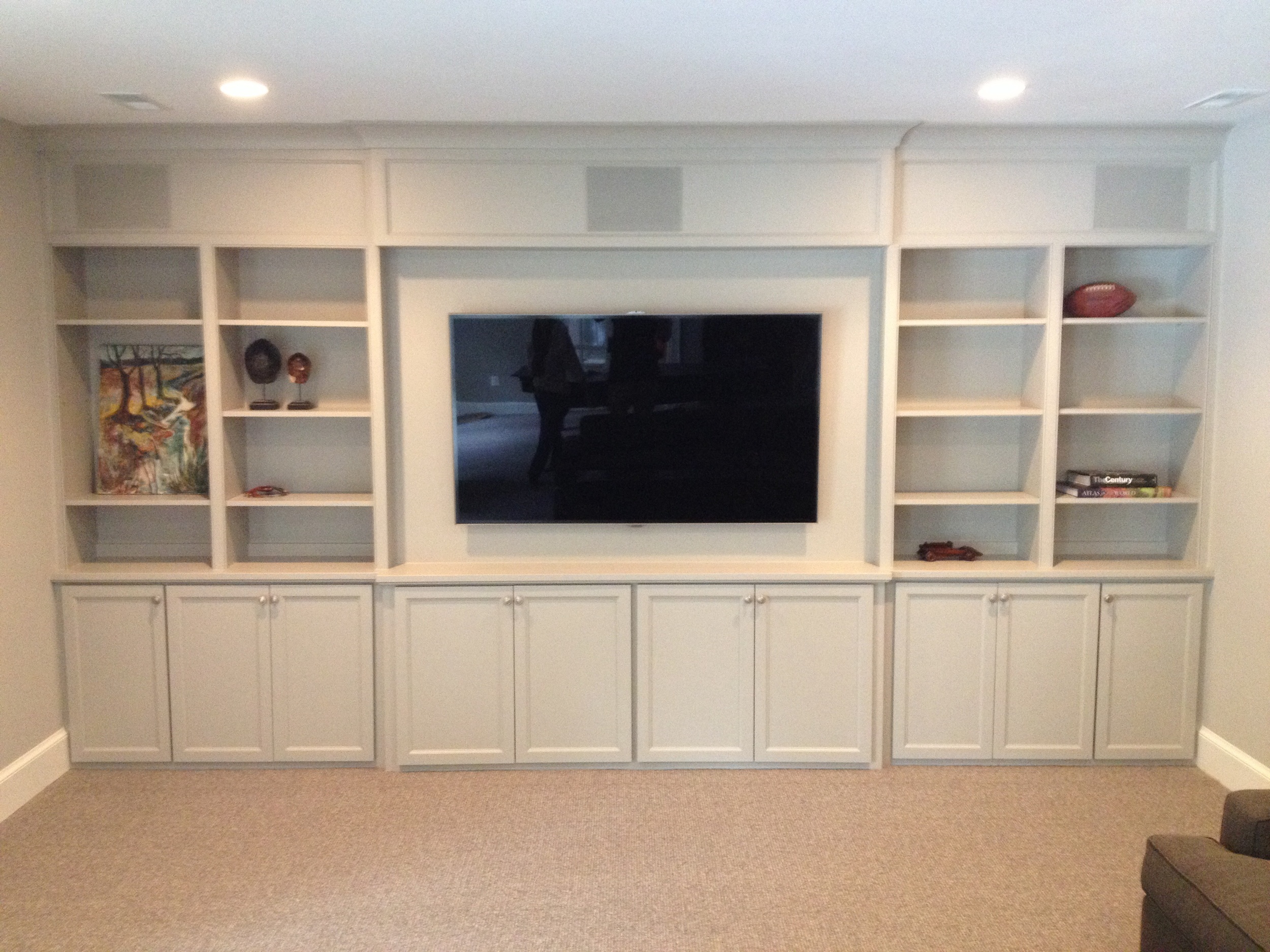 Home theater with speakers in panels above.