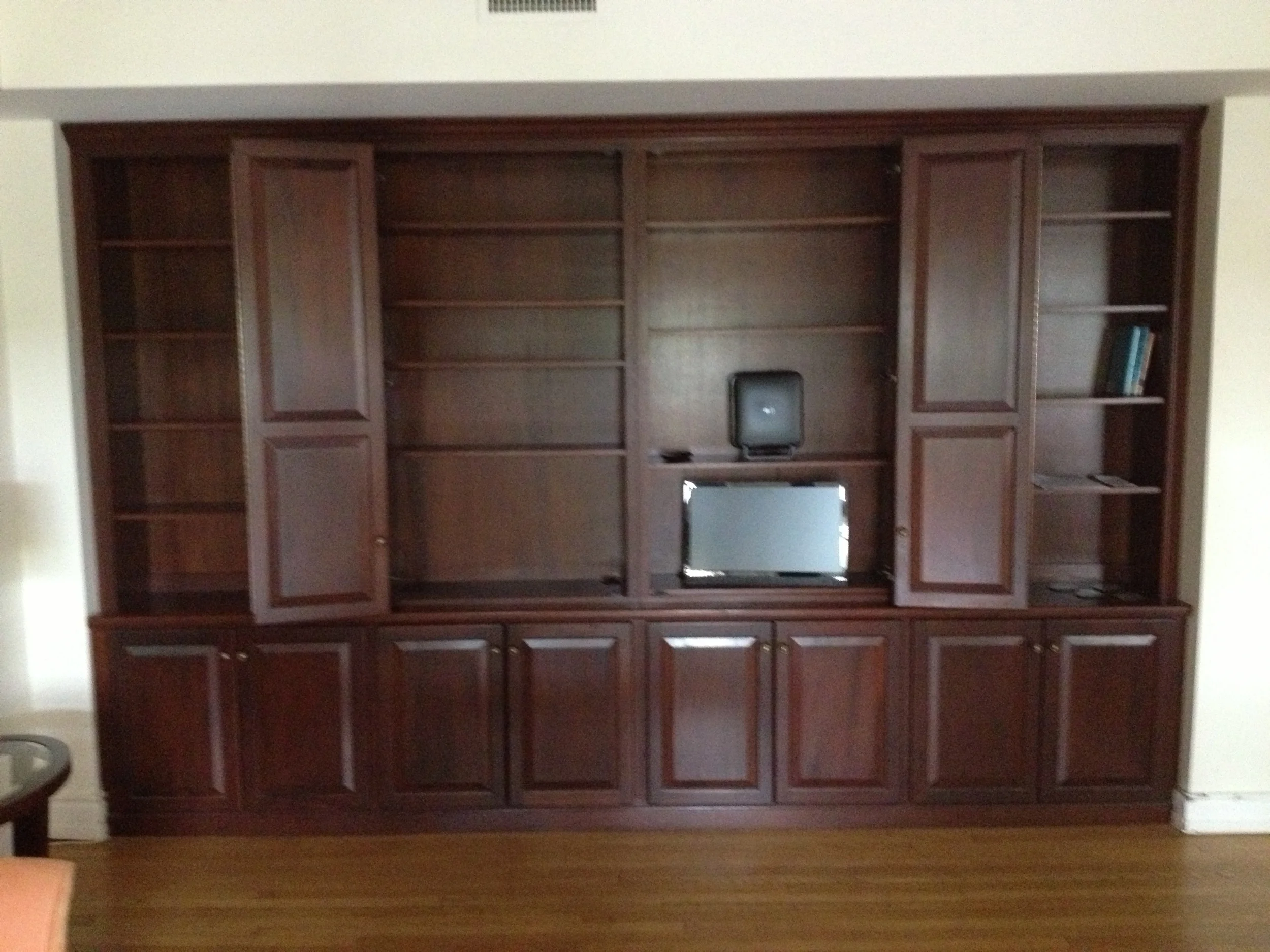 Mahogany home office with doors opened.