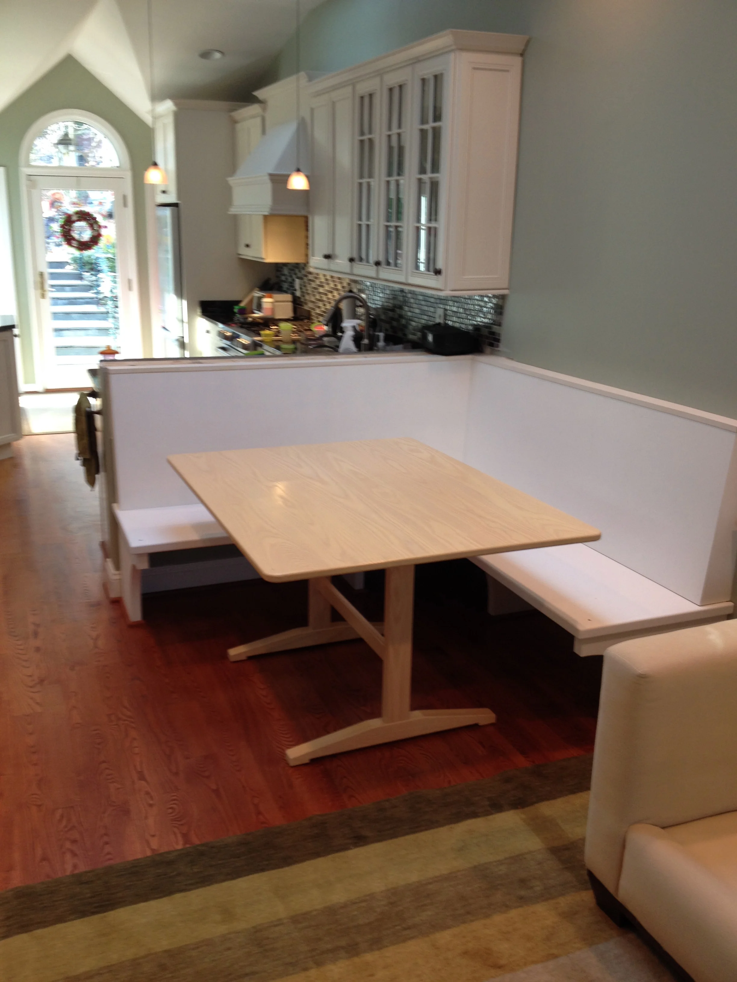 Banquette with trestle table for kitchen area.