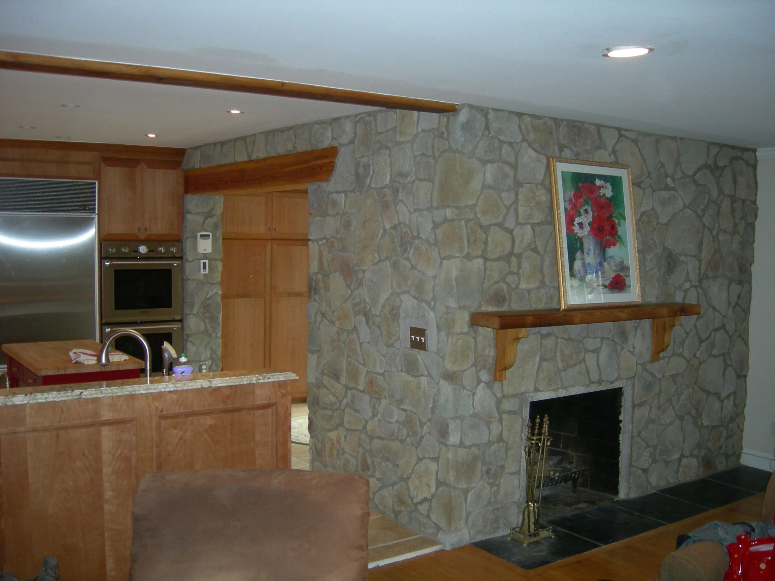 Stone and reclaimed timbers finish the cherry kitchen.