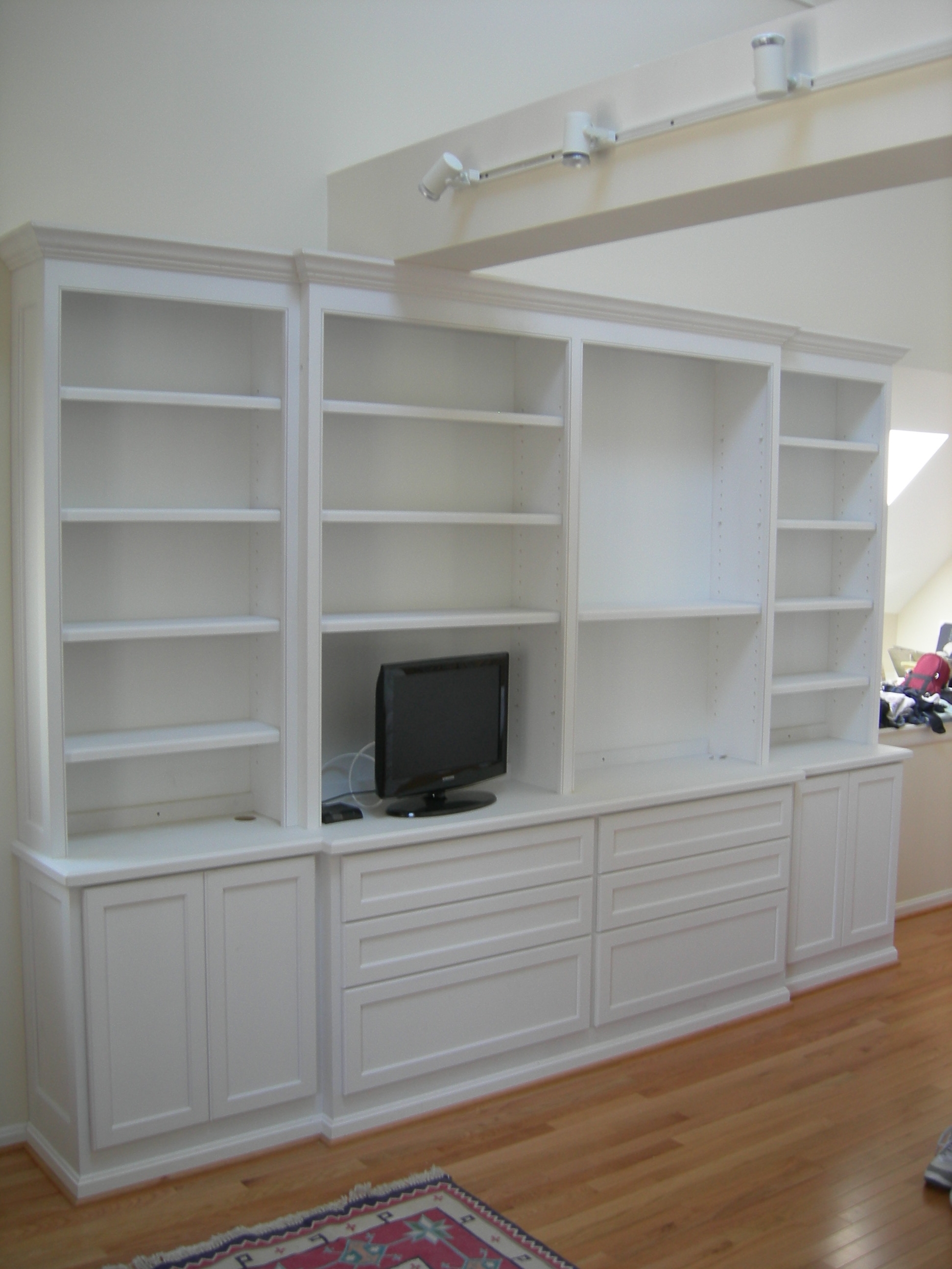 Bookcases, cabinets and drawers for bedroom.