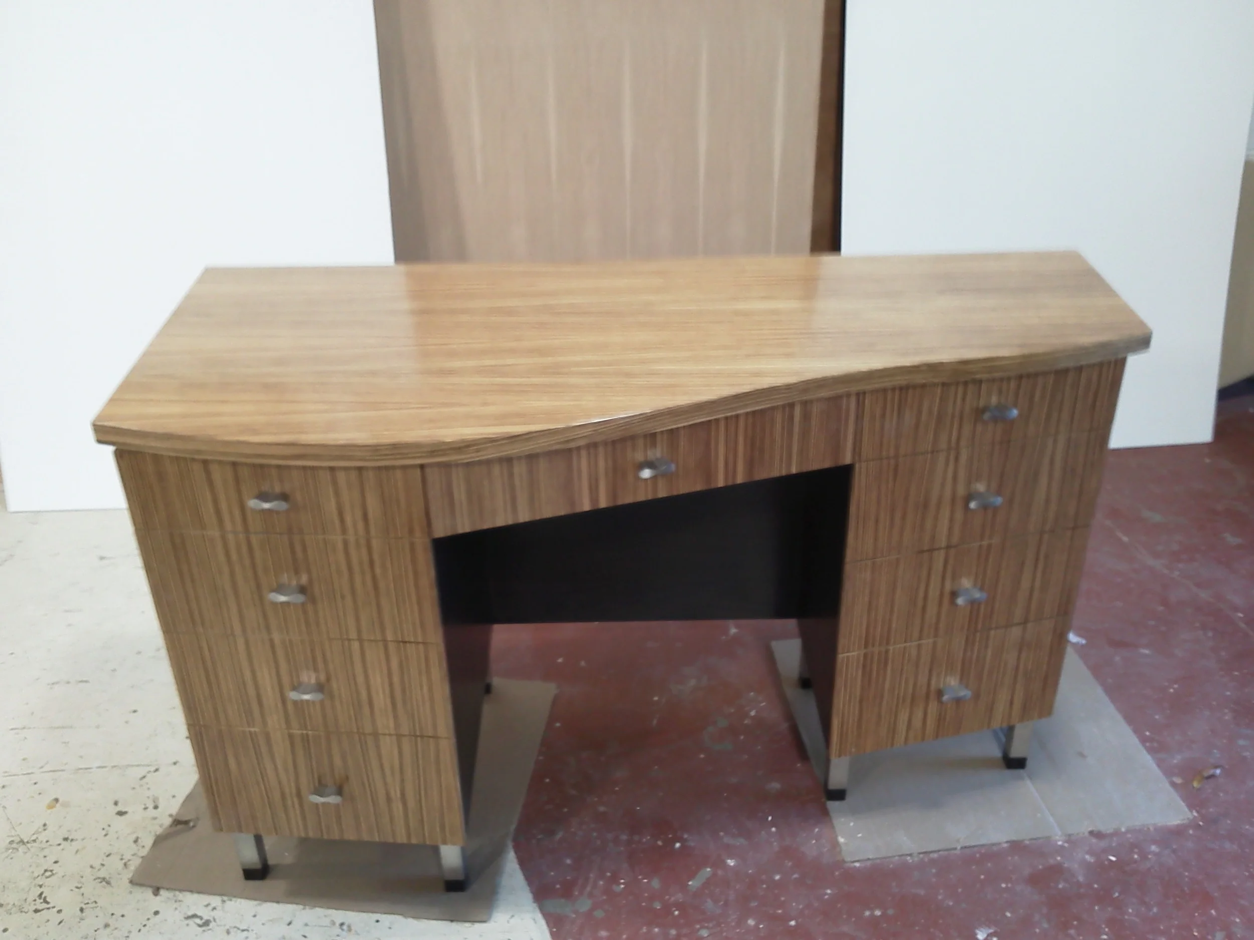 Zebra wood and walnut vanity.