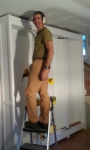 Here I am installing a library in Chevy Chase. &nbsp;Almost don't even need the ladder and the level is just for show.