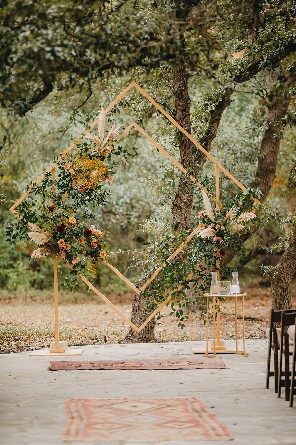 gorgeous-wedding-ceremony-diamond-backdrop-with-flowers-for-fall-wedding.jpg