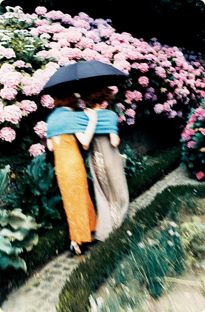 photo shoot styled by Grace Coddington, two art nouveau inspired models on a garden path