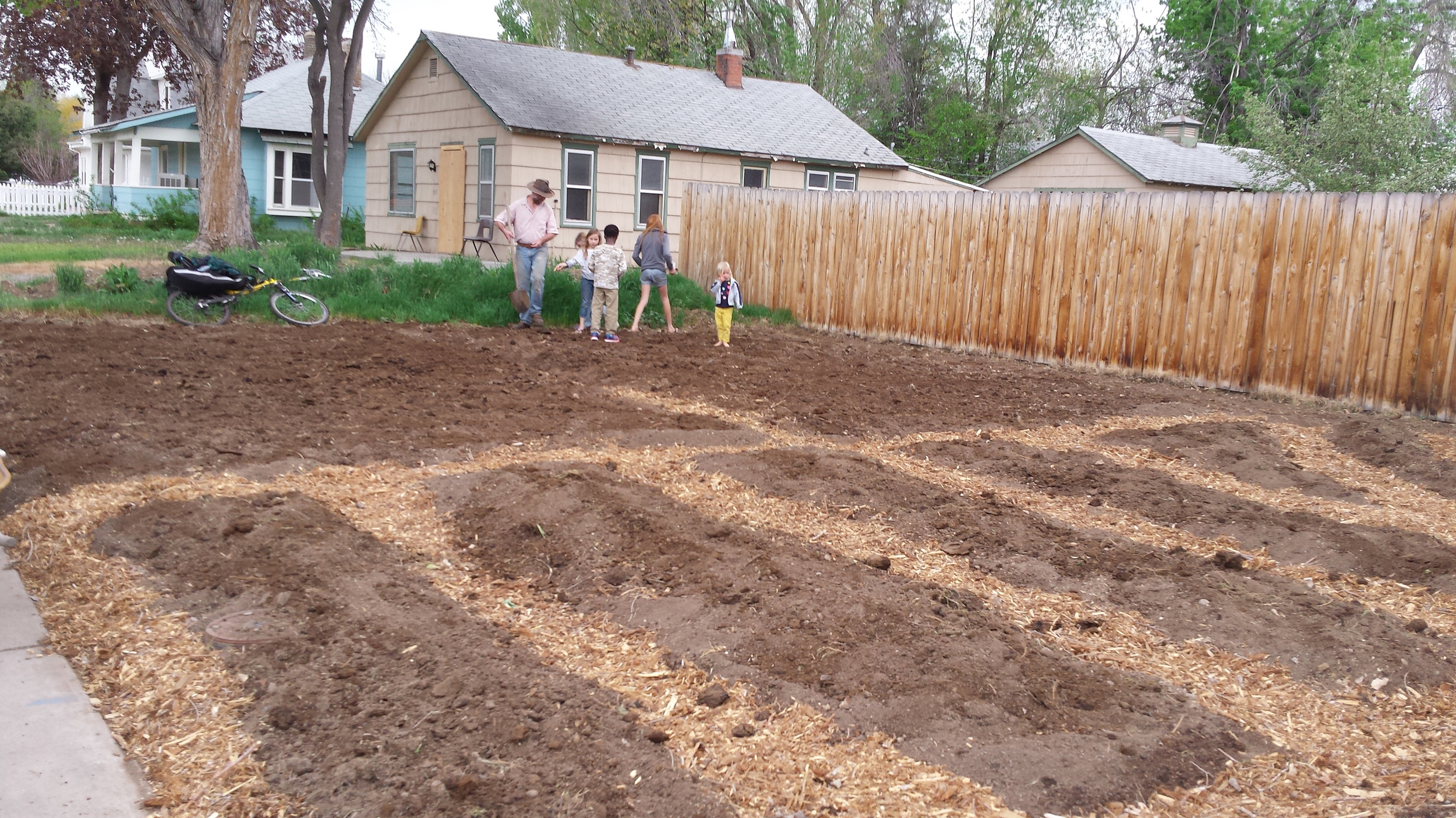 The kids helping Will plant our three sisters garden: corn, beans and squash