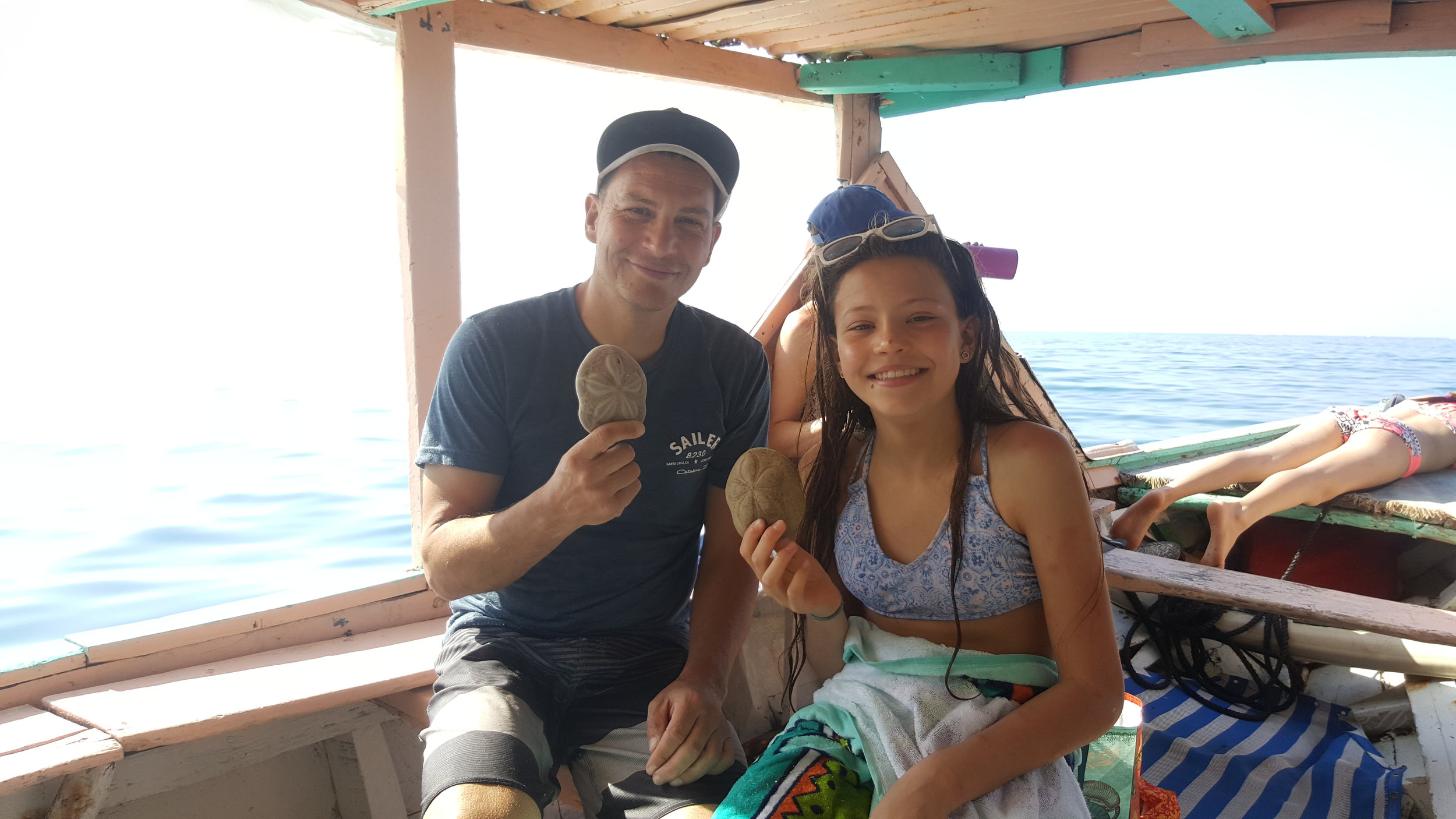 These two enjoyed diving for shells. It was Bella's first time snorkeling.