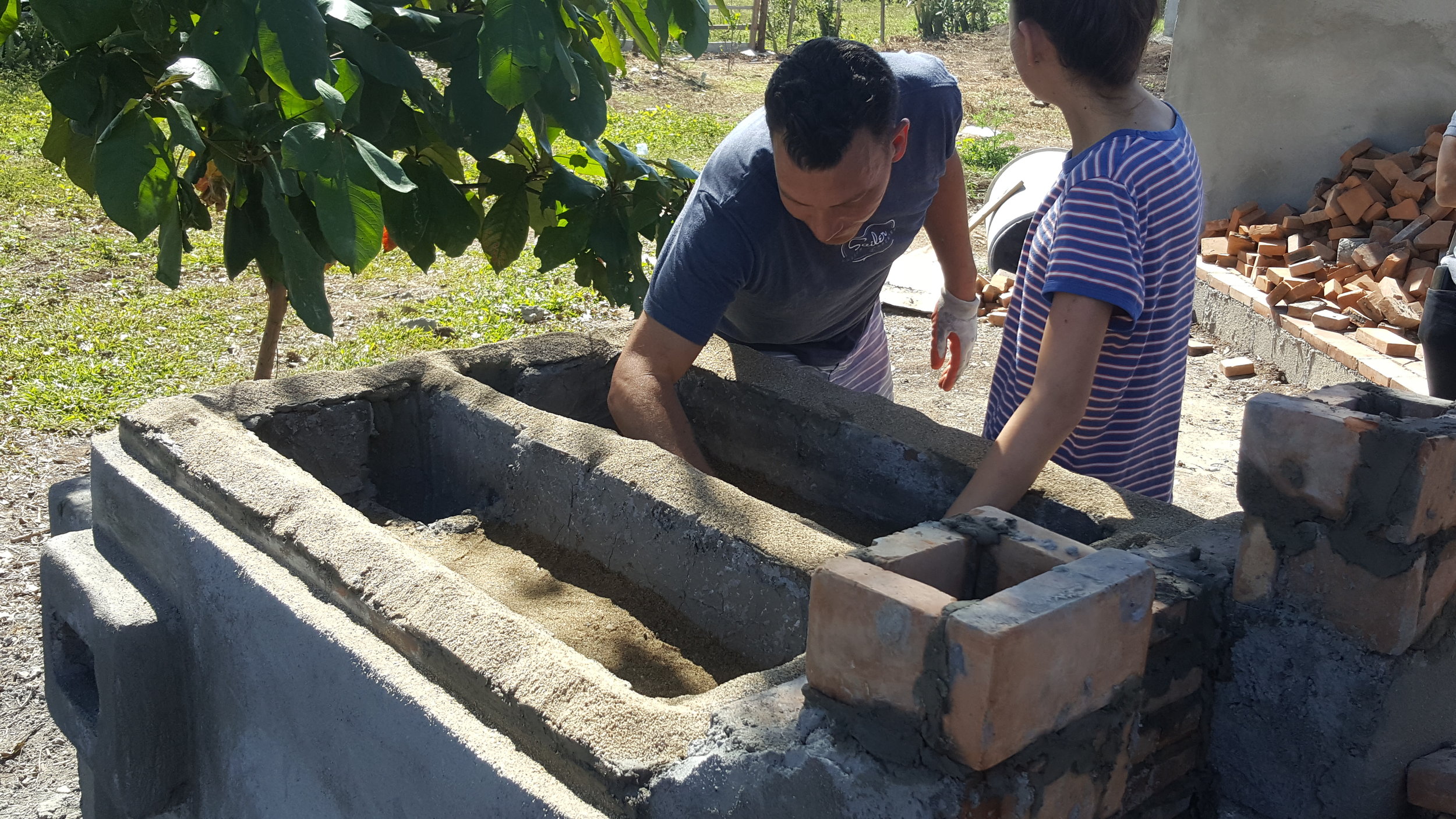 We laid a bed of sand along the top, hoping that the weight of the steel plate would rest on that, and give it room to expand. 