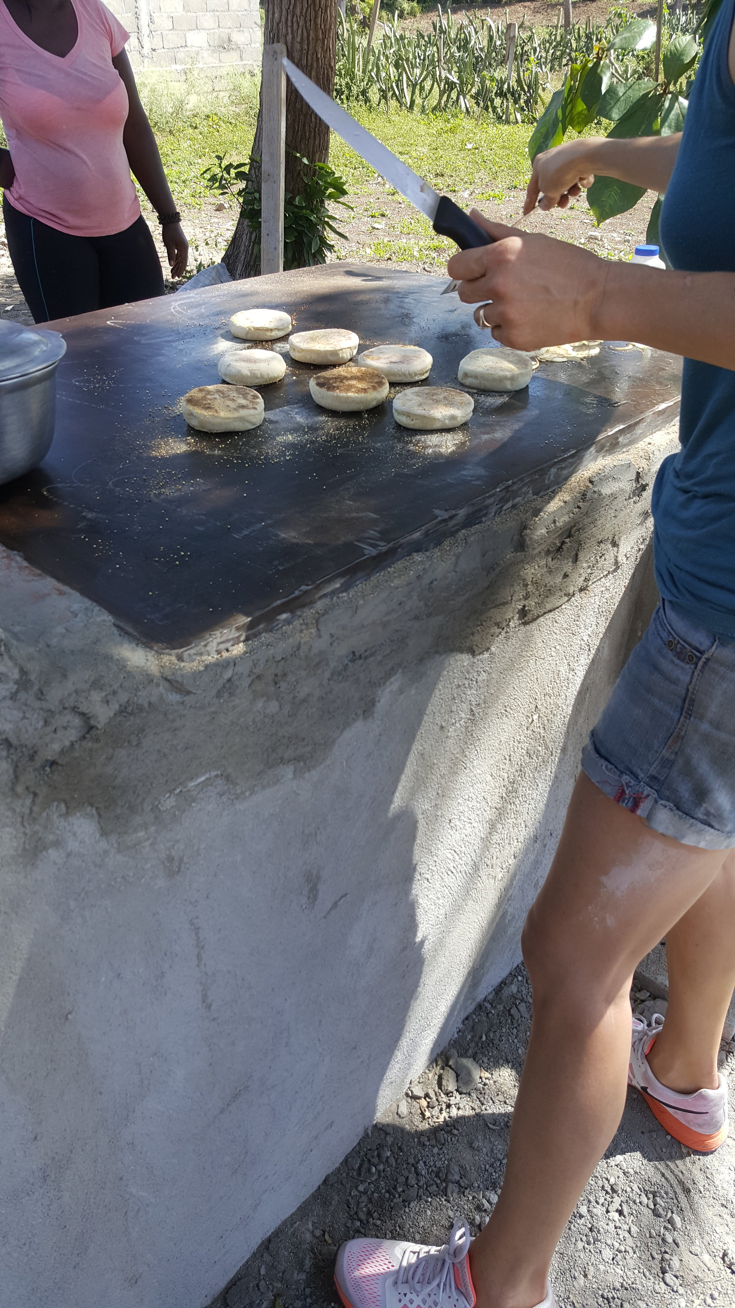 Cooking our first sourdough muffins on the griddle.