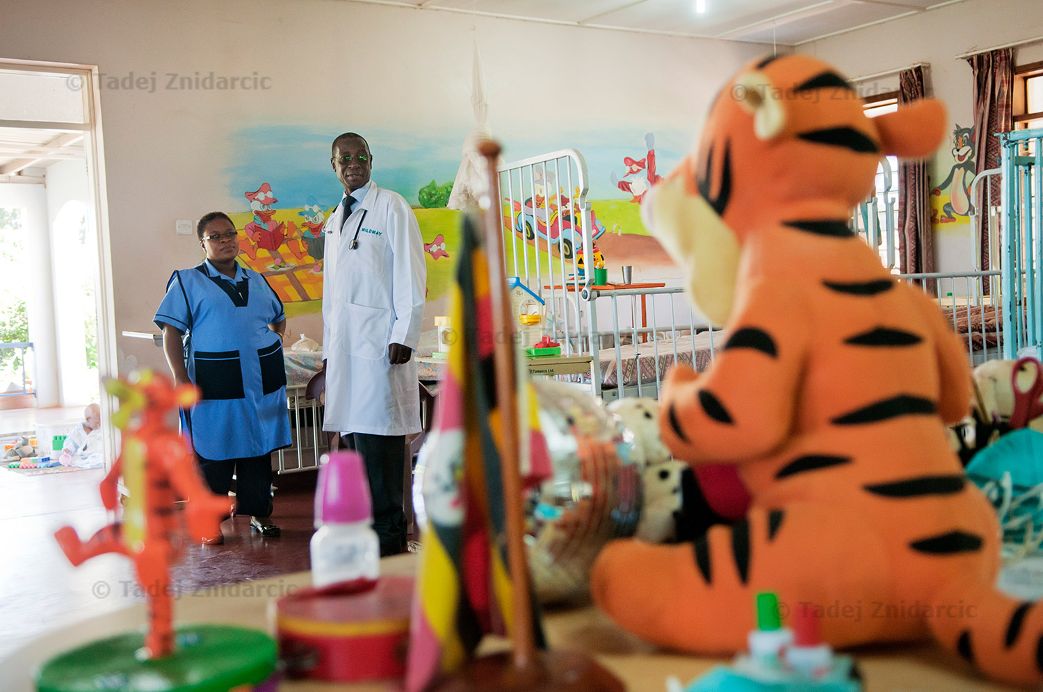 Dr. Stephen Watiti and nurse Rose Nannyonjo visit children's ward at Mildmay hospital.
