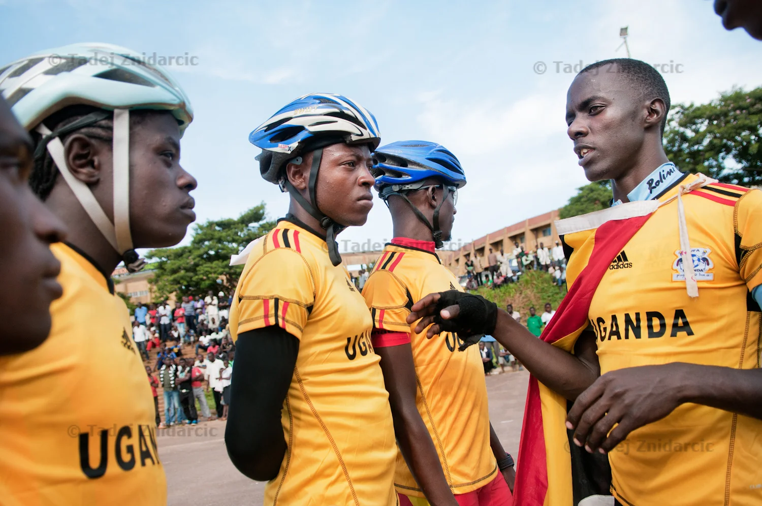 Mugabi Julius instructs his teammates Senkungu Sula, Serugo Geofrey (aka Kitintale), Ssenyojo Isaac, and Kisitu Joseph before the start of 2nd East African inline skating competition at Mandela National Stadium's parking lot in Kampala, Uganda. Teams from Kenya and Rwanda also participated.
