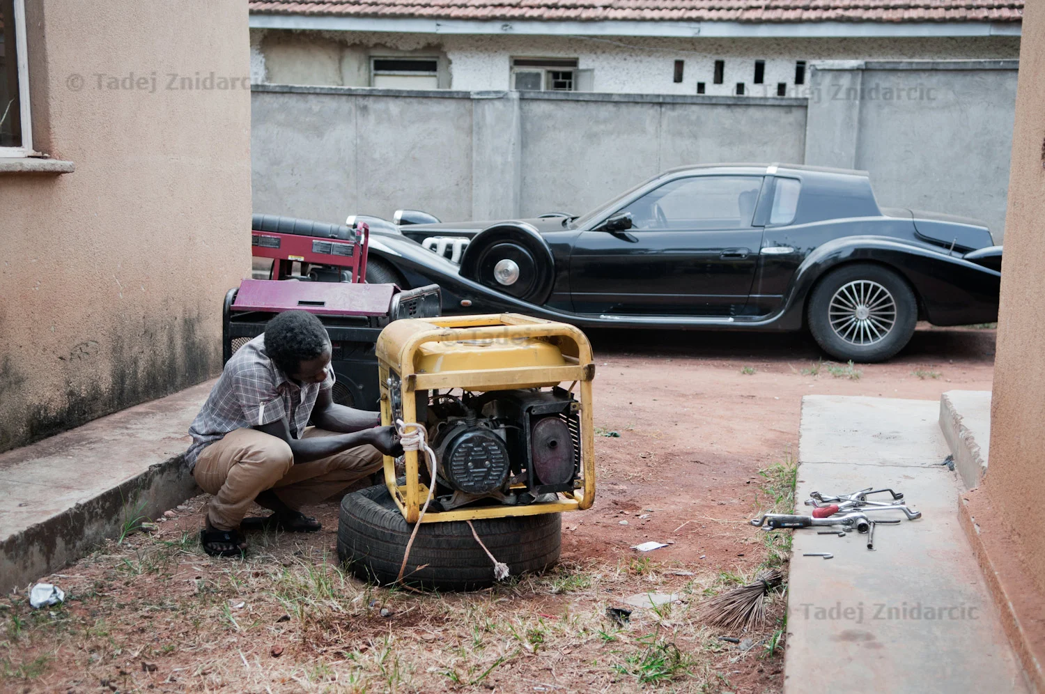 Serugo Geofrey (aka Kitintale) repairs generator in the compound of Silk Events, an events company in Kampala, Uganda. Kitintale has been skating since 2010 and has competed in several international competitions in Uganda and Kenya. He is strongest in distance races. Sometimes his work takes him on the road around Uganda and he wishes he would have more time for practice.