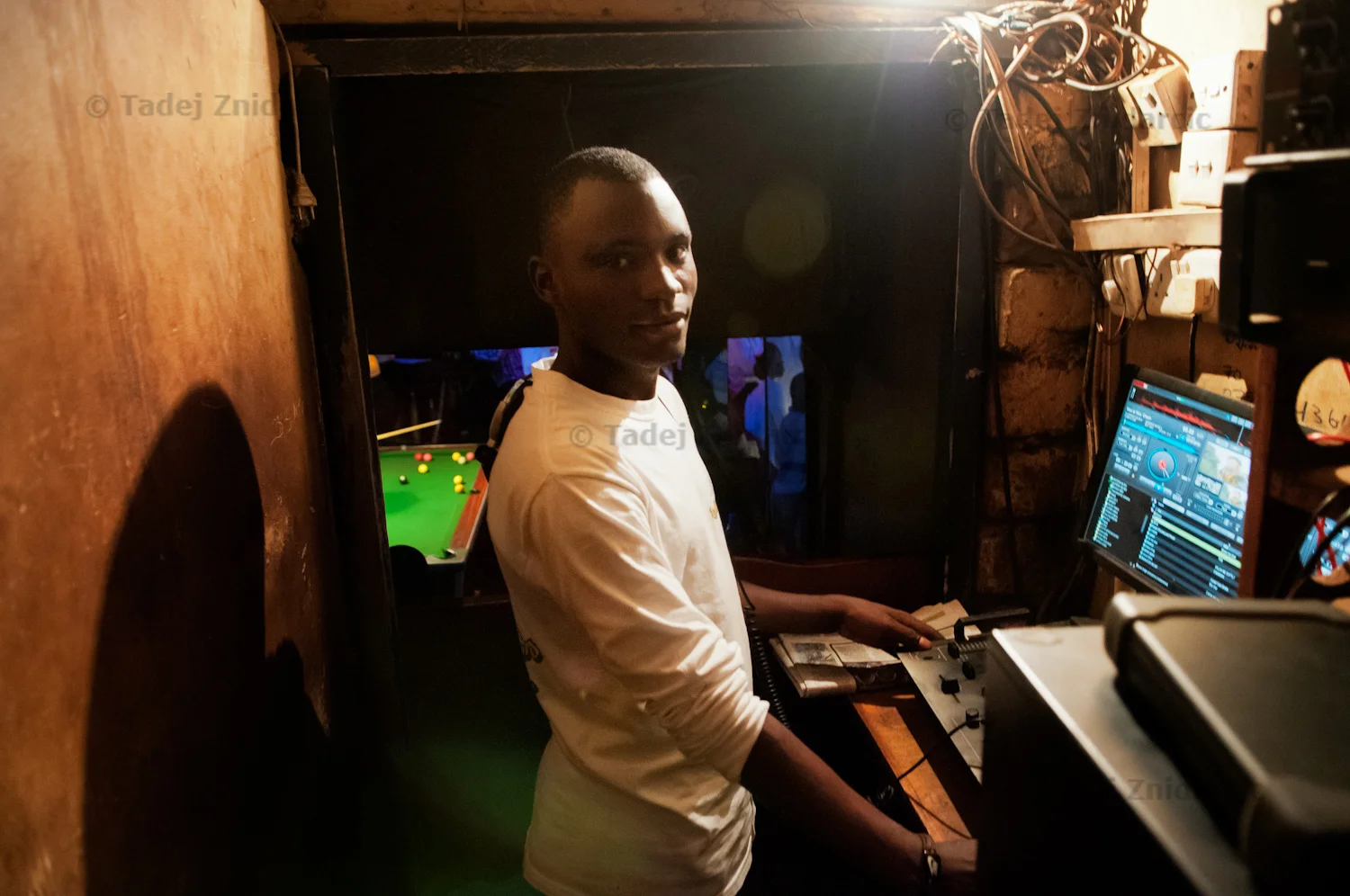 Senkungu Sula works as a DJ in Top Pub in downtown Kampala, Uganda. He spins music from 8pm to 4am six days a week.