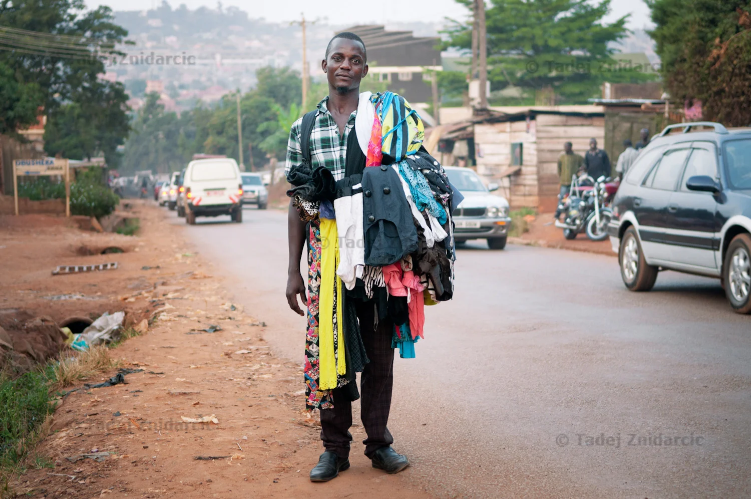 Kisitu Joseph sells clothes in the streets in Kampala, Uganda (from Passion for Speed).