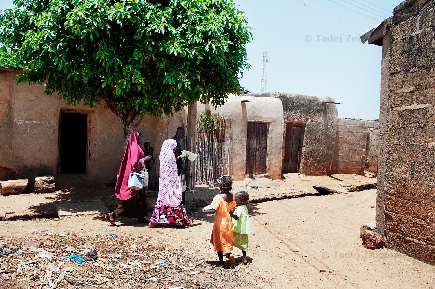 House-to-house polio vaccination team is passing some children who had already been immunized in Kura, Kano State, during Subnational immunization days. They were on the way to revisit a house where earlier nobody was home.