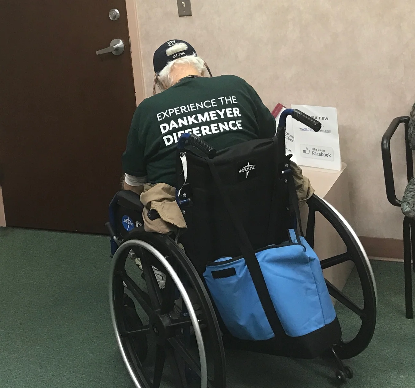 Mr Jennings preparing to leave the Sinai Office, wearing his Dankmeyer T shirt.