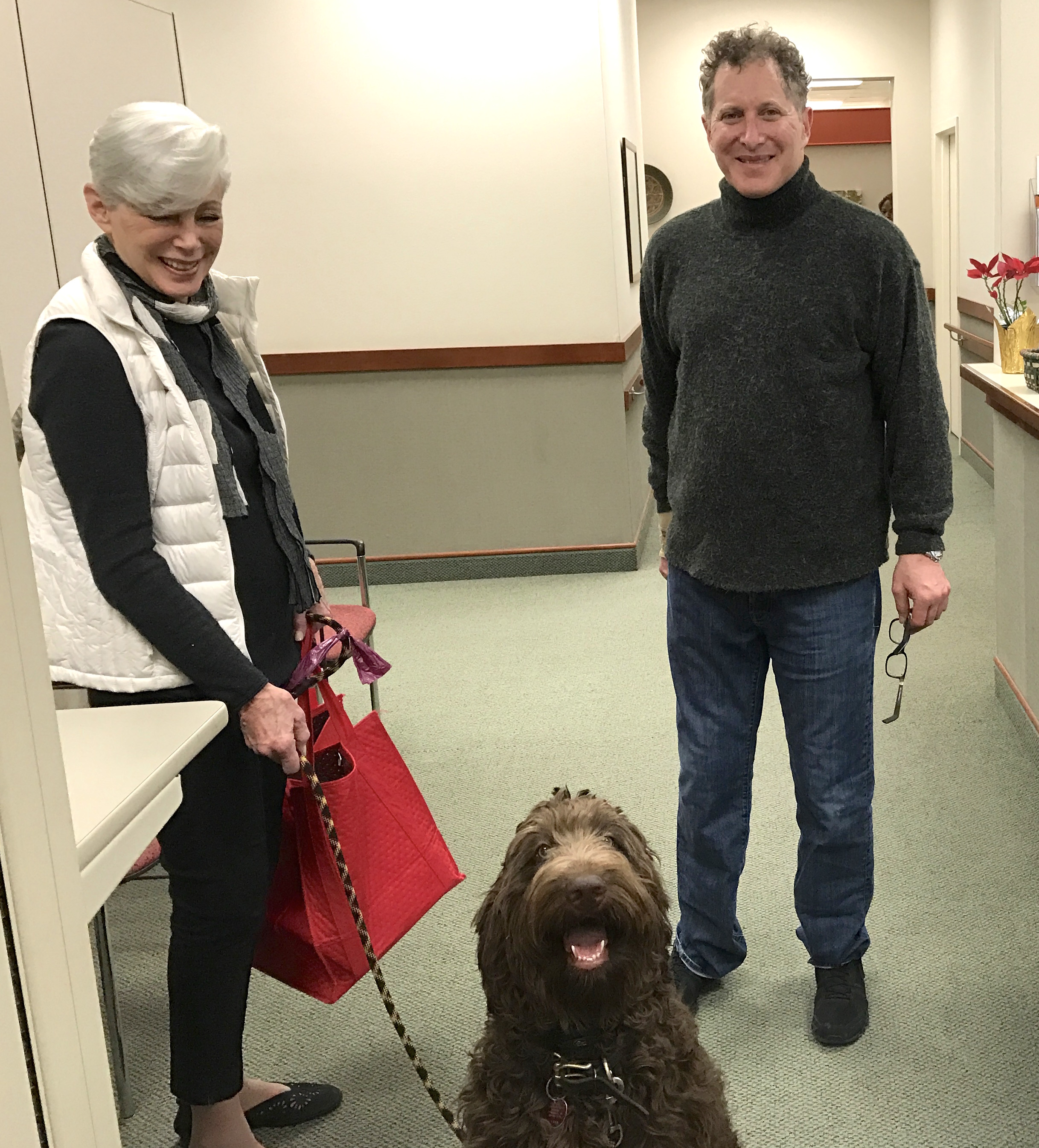 Dr. Andrew Rubin at Dankmeyer, with his mother and Luca the Goldendoodle.