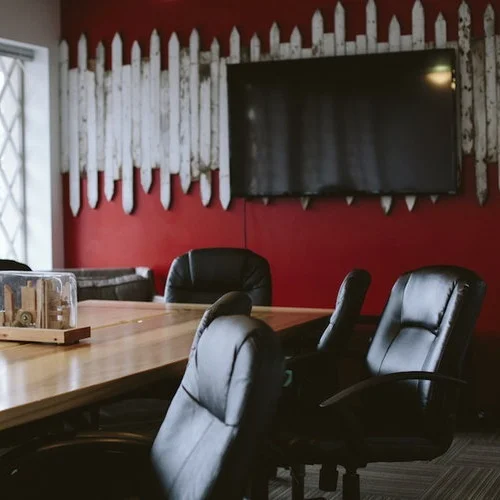 The Conference Room is suitable for meetings with up to 15 people. The rectangular table can fit up to 10 people around it with other seating in the room. Equipped with a large whiteboard, TV with Chromecast or HDMI connectivity (w/ dongle for Apple).
