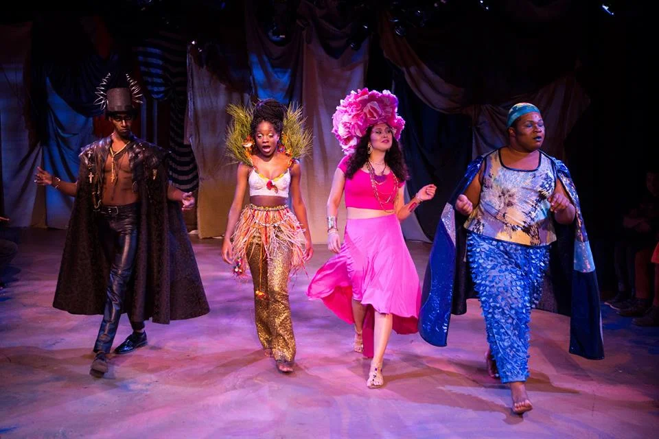 Erzulie (2nd from right ) wearing custom built skirt, and Agwe (far right) wearing costume made from recycled fabric and shower curtains/Photo by Matthew Murphy