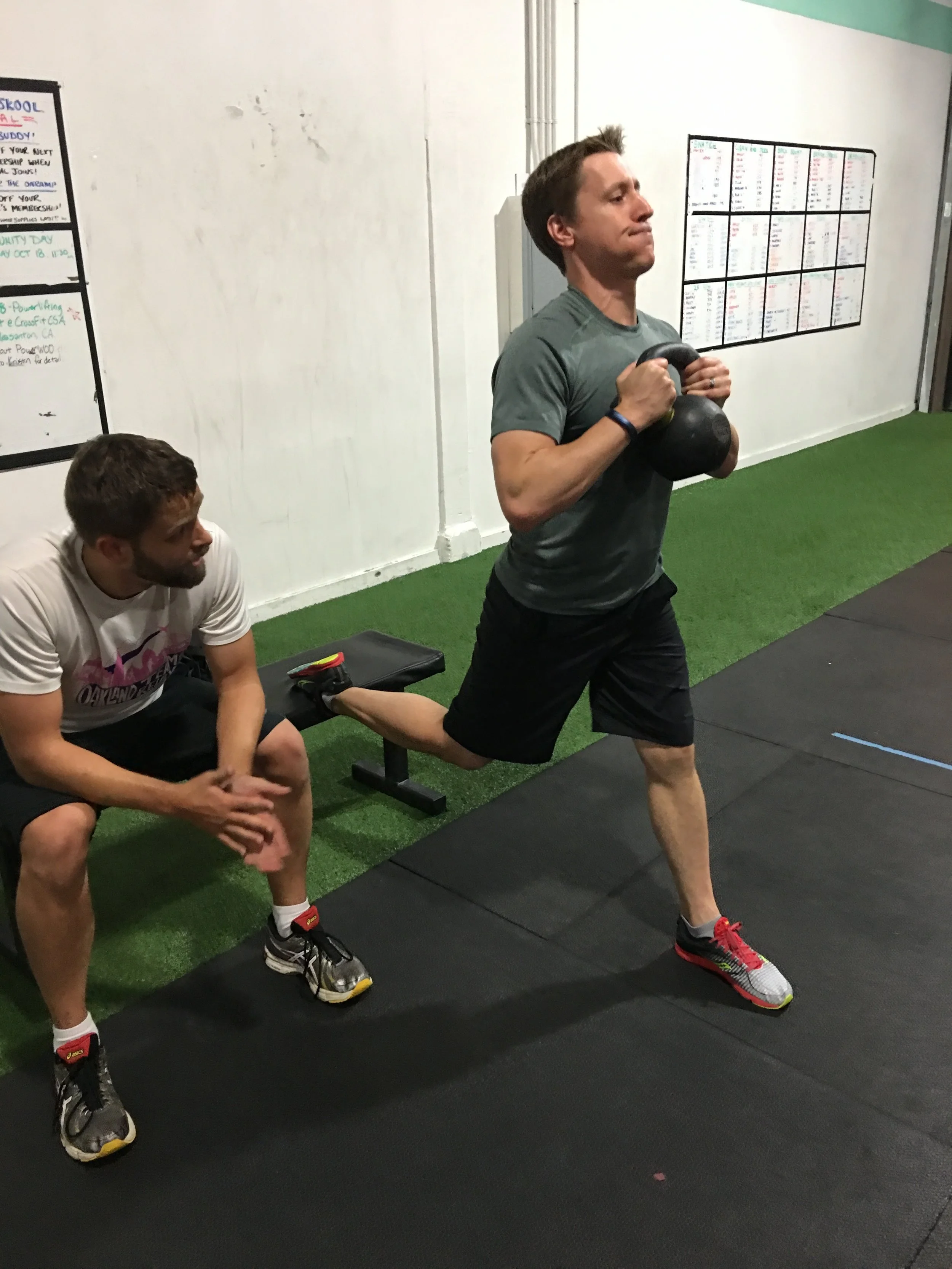 Kevin anchoring Jeremy's split squats