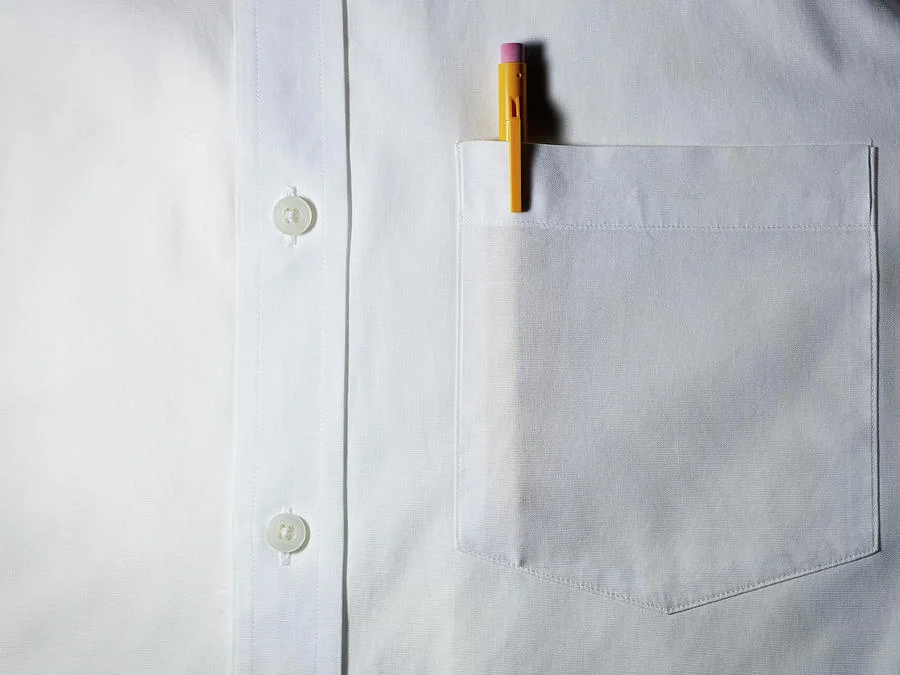 Funny how the dress shirt with a pocket also has a conventional placket- I wonder if it has a button down collar?