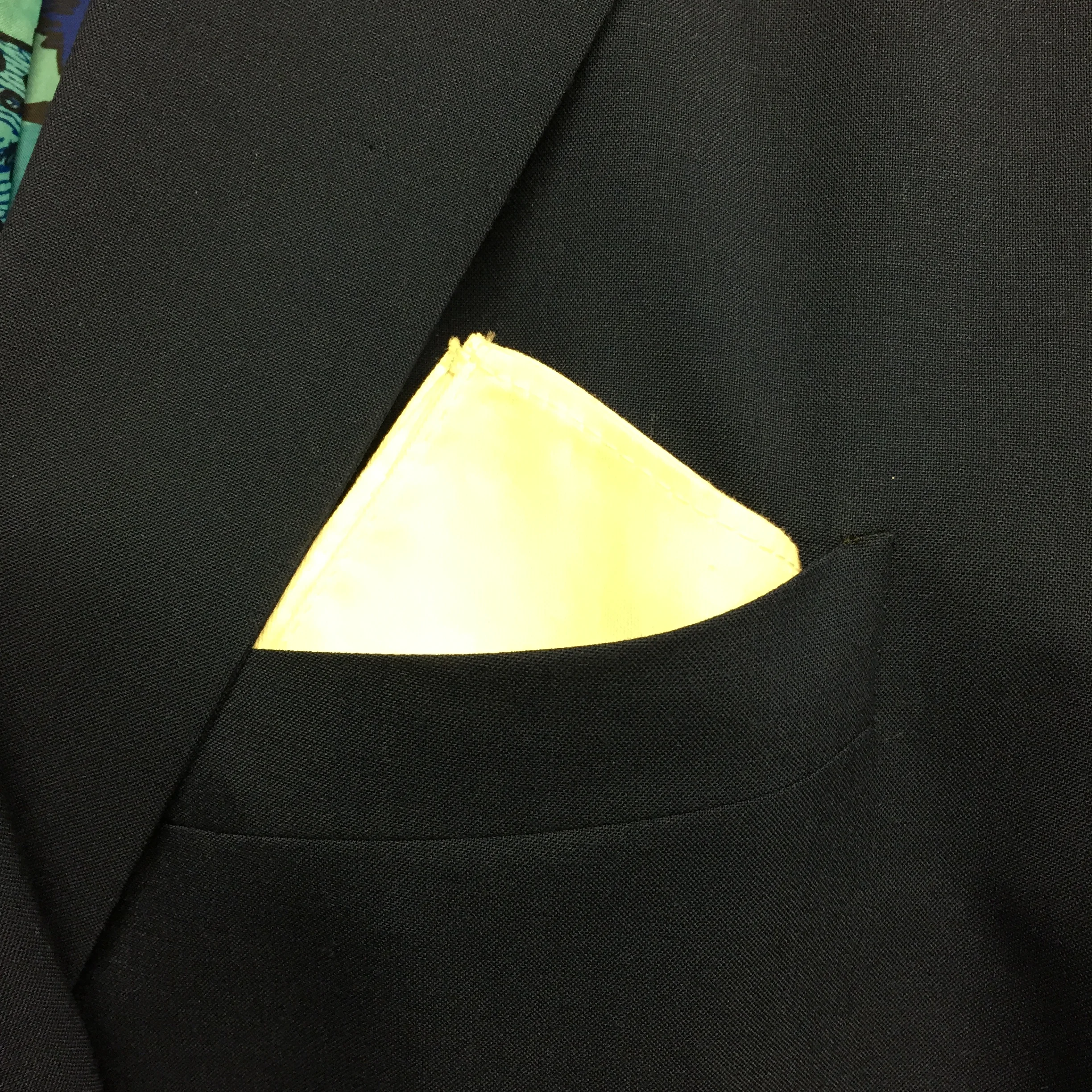 Here the pocket square is folded into a square, and the four points are together. Just makes more a crisp "blocking" effect. 