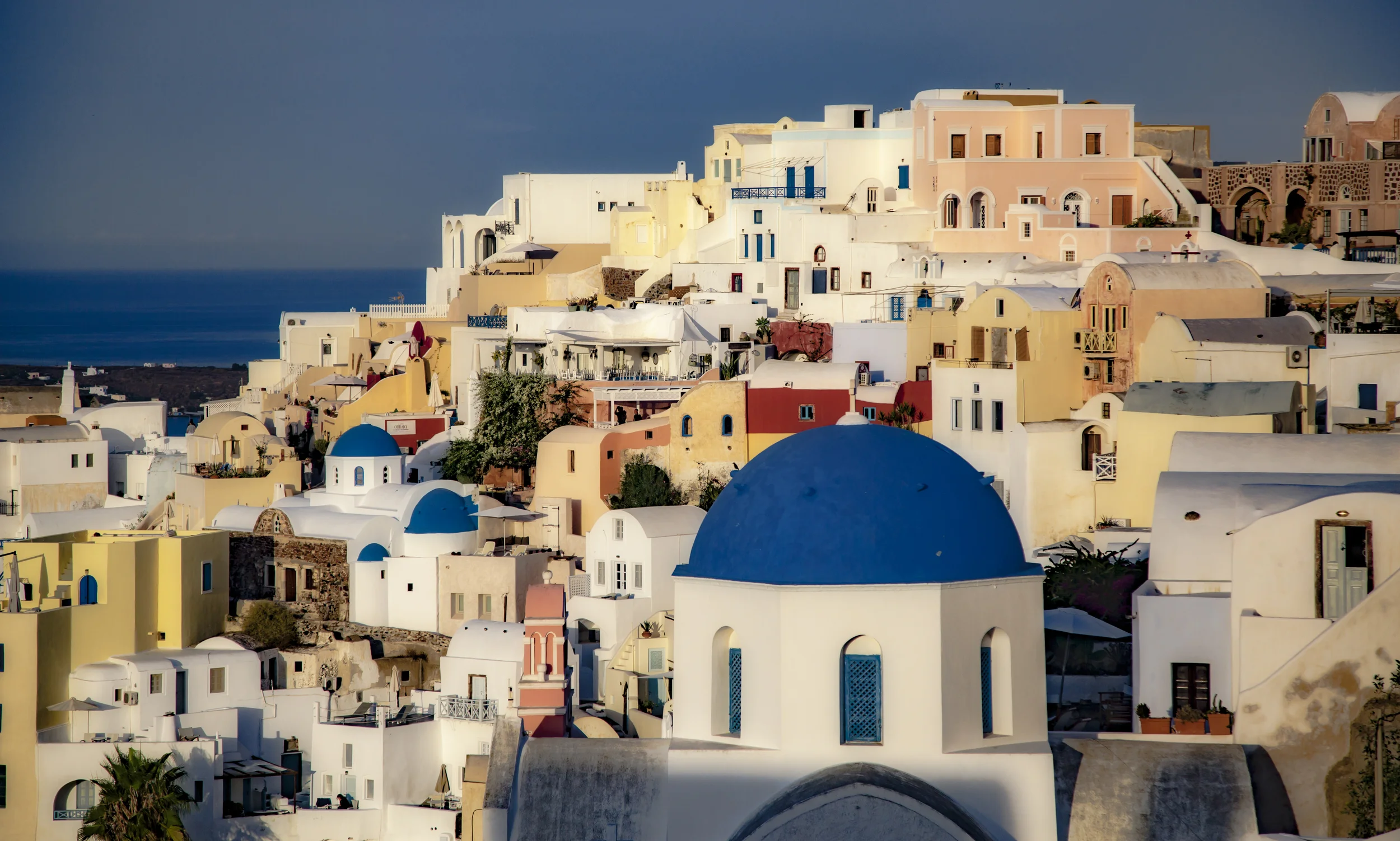 The colorful city is filled with winding pathways that lead down to the rocky coast and neighboring villages.