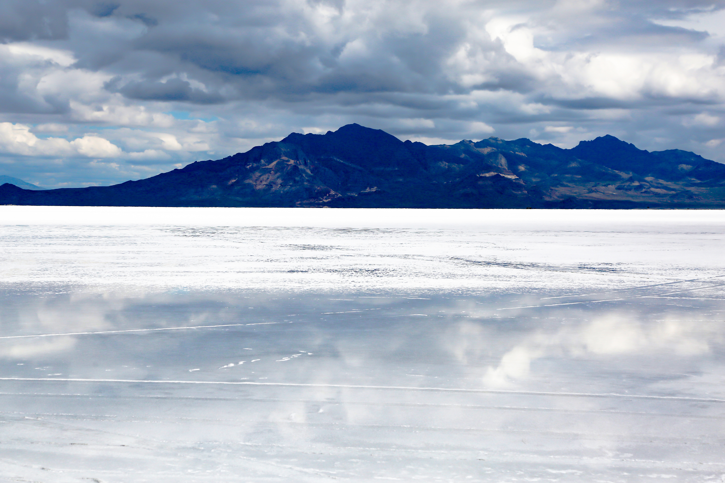 A storm descends upon the salt flats giving the landscape an ominous mood.