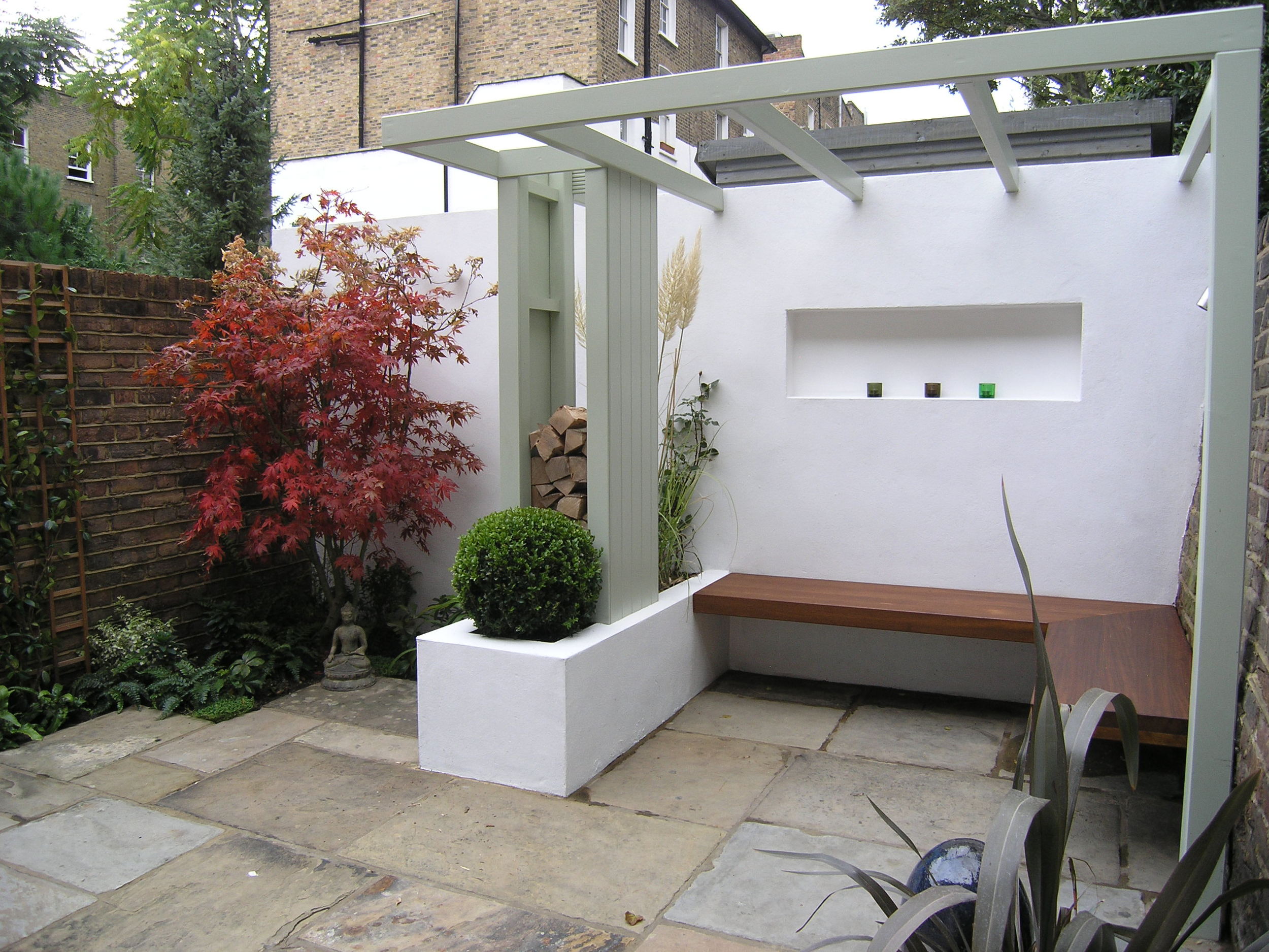 Contemporary Islington garden design with Yorkstone patio and planting