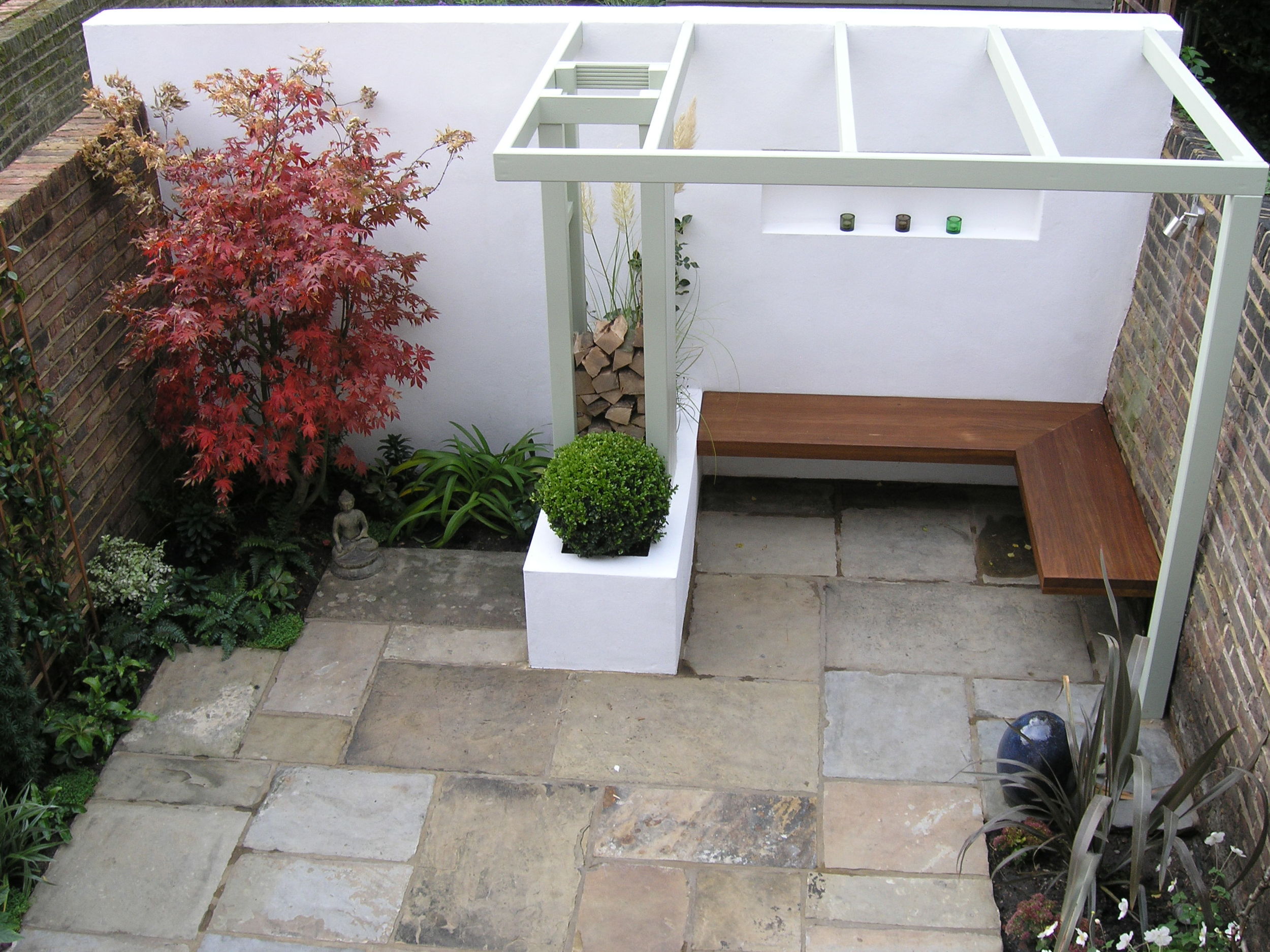 North London rear garden with Yorkstone patio and bespoke furniture